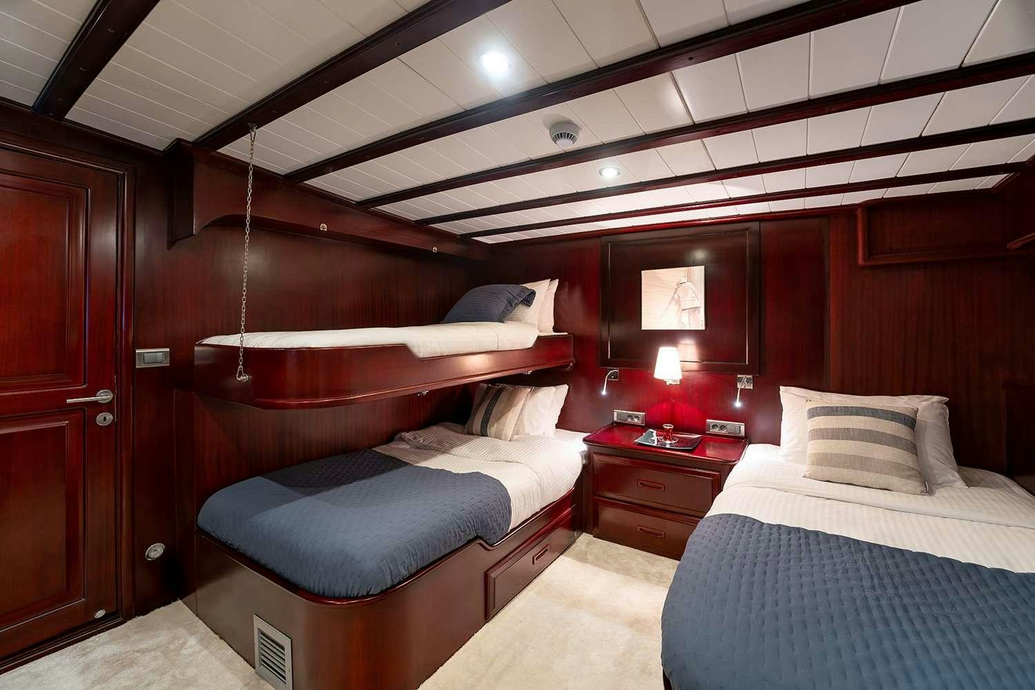 a room with two beds aboard ALWAYS SMILE Yacht for Charter