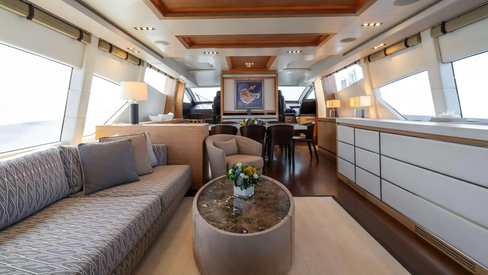 a living room with a couch and a coffee table aboard ELEVEN I Yacht for Charter