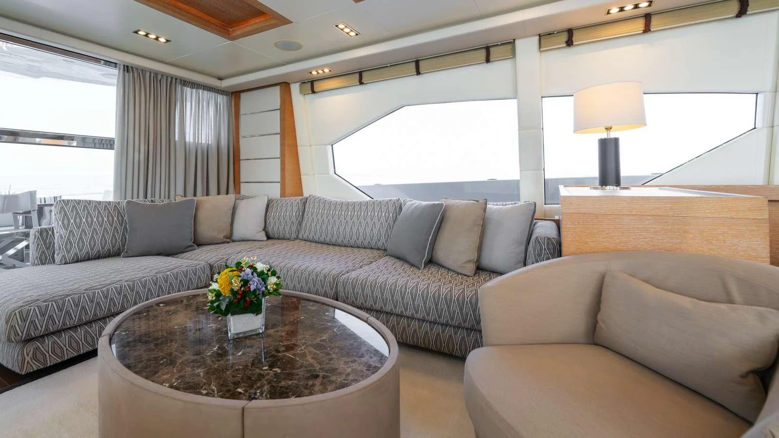 a living room with a couch and a coffee table aboard ELEVEN I Yacht for Charter