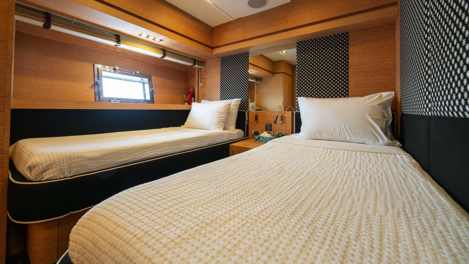 a room with two beds aboard ELEVEN I Yacht for Charter