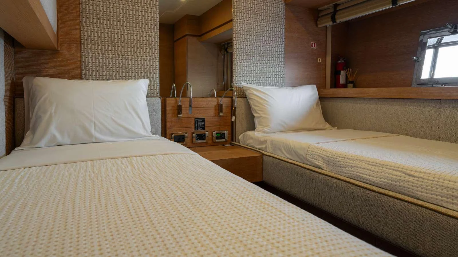a couple of beds in a room aboard ELEVEN I Yacht for Charter