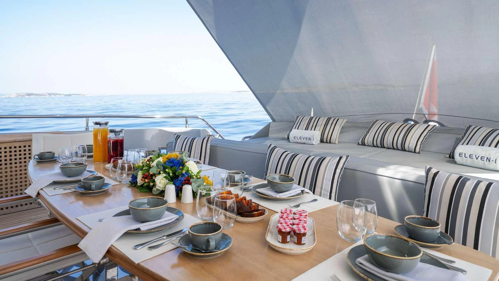a table with food and drinks on it aboard ELEVEN I Yacht for Charter