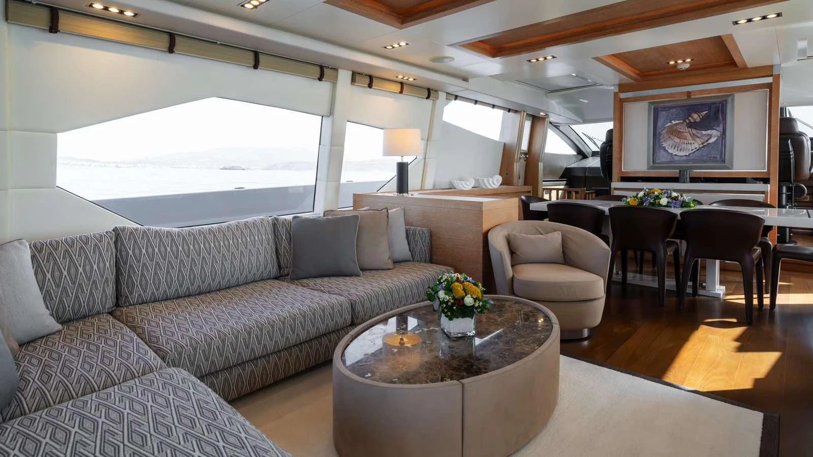 a living room with a couch and a coffee table aboard ELEVEN I Yacht for Charter