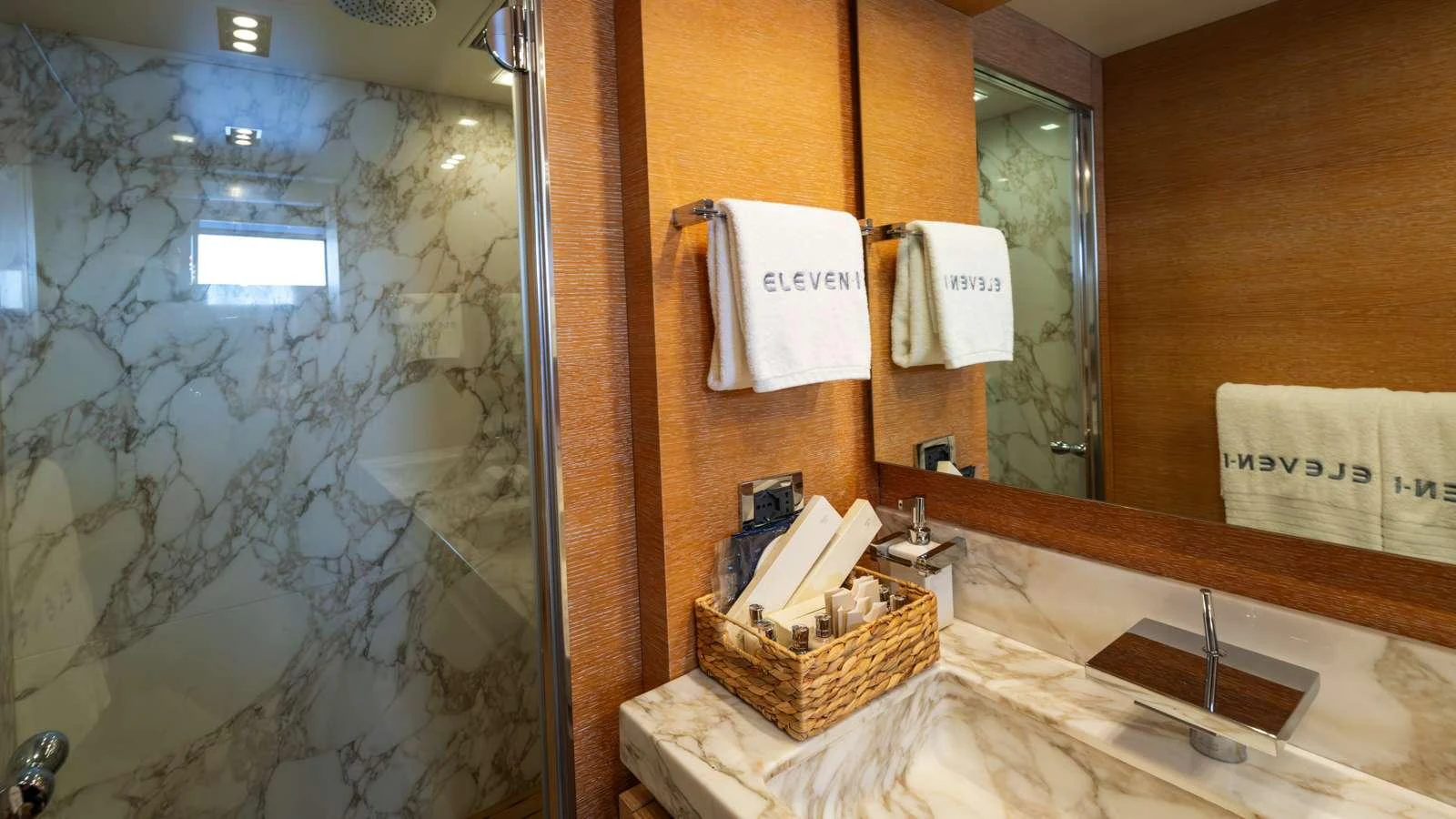 a bathroom with a large mirror aboard ELEVEN I Yacht for Charter