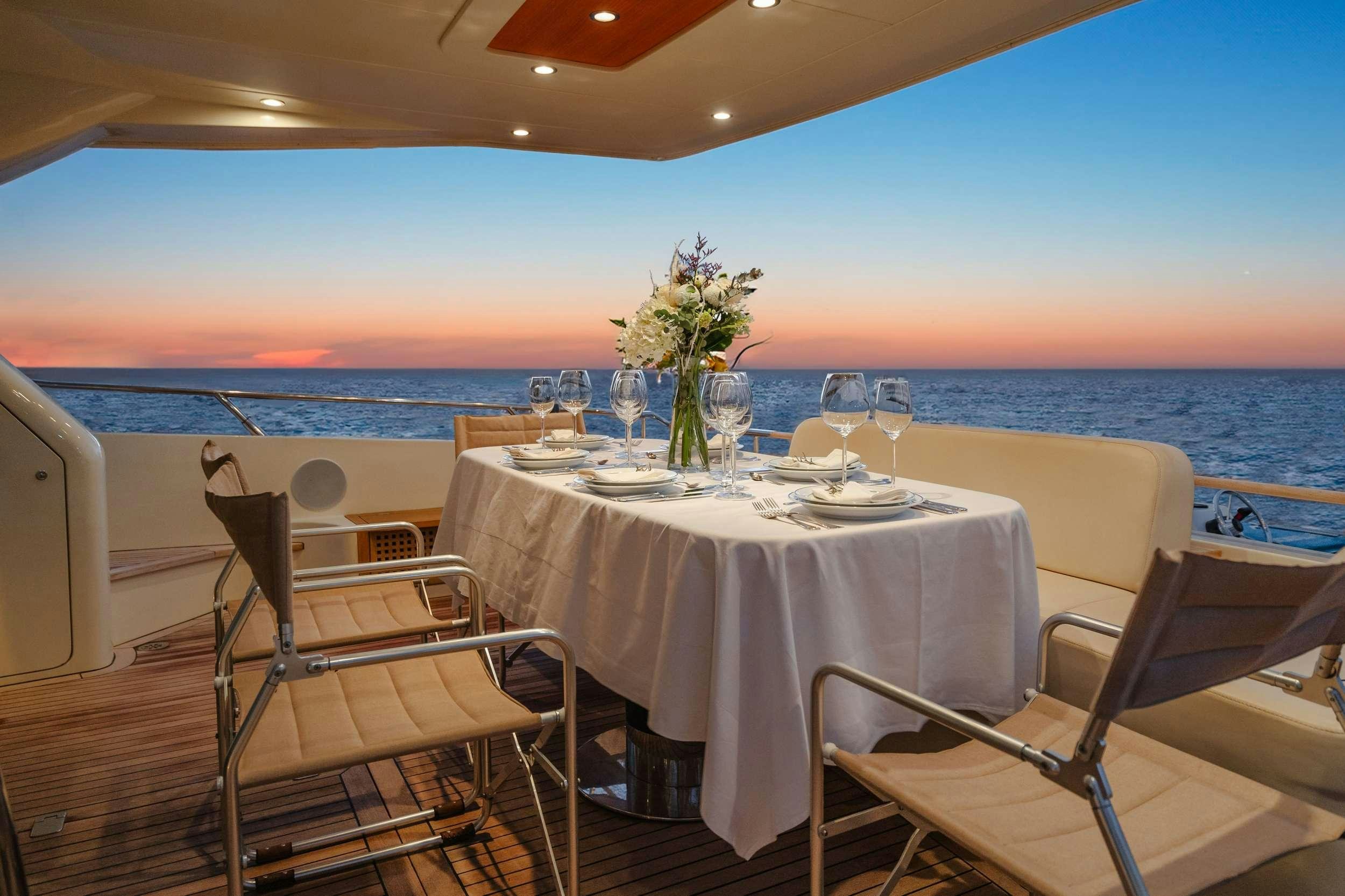 a table set for a meal on a boat aboard ETERNO Yacht for Charter