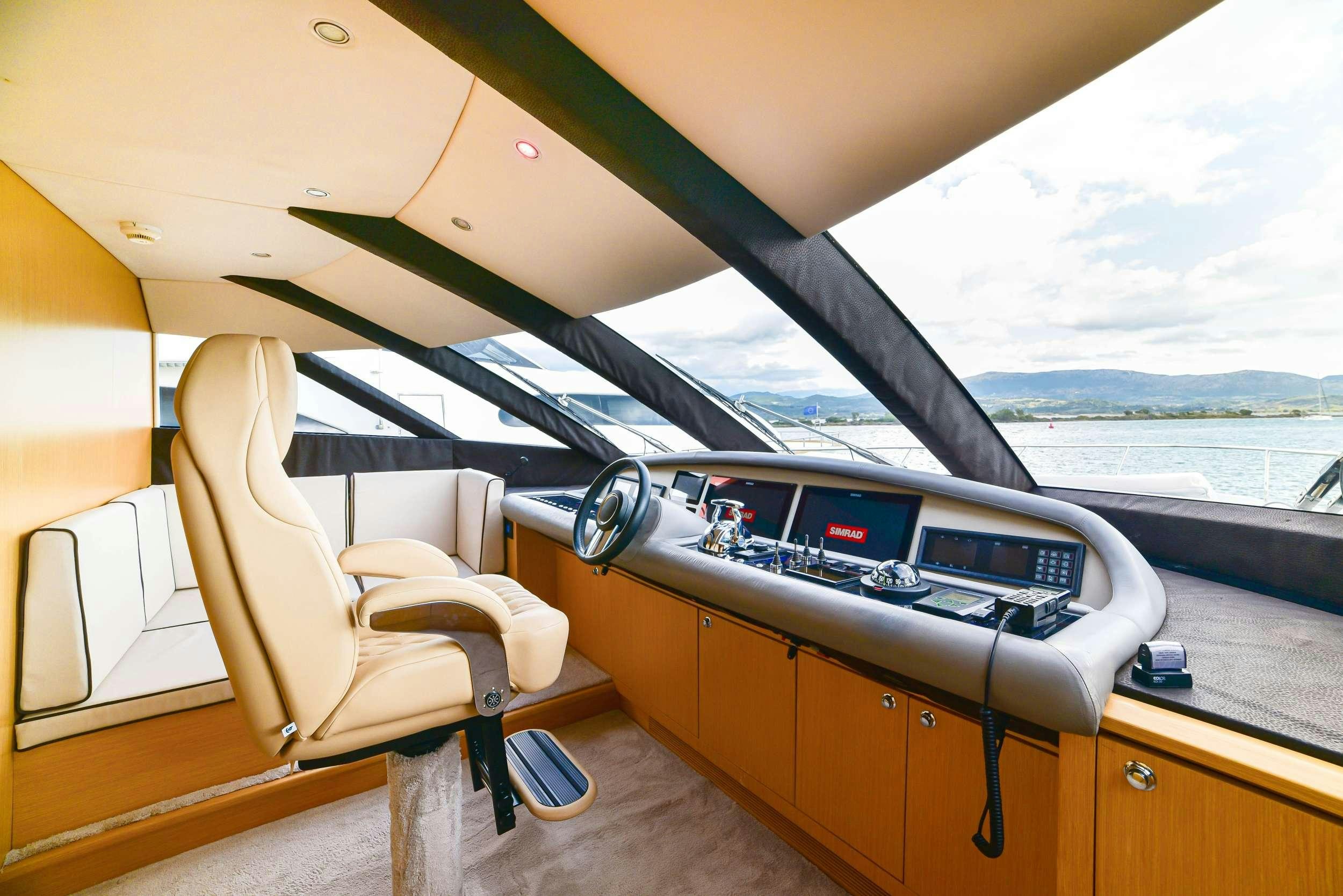 a boat with a keyboard and a chair on the deck aboard STELA 117 Yacht for Charter
