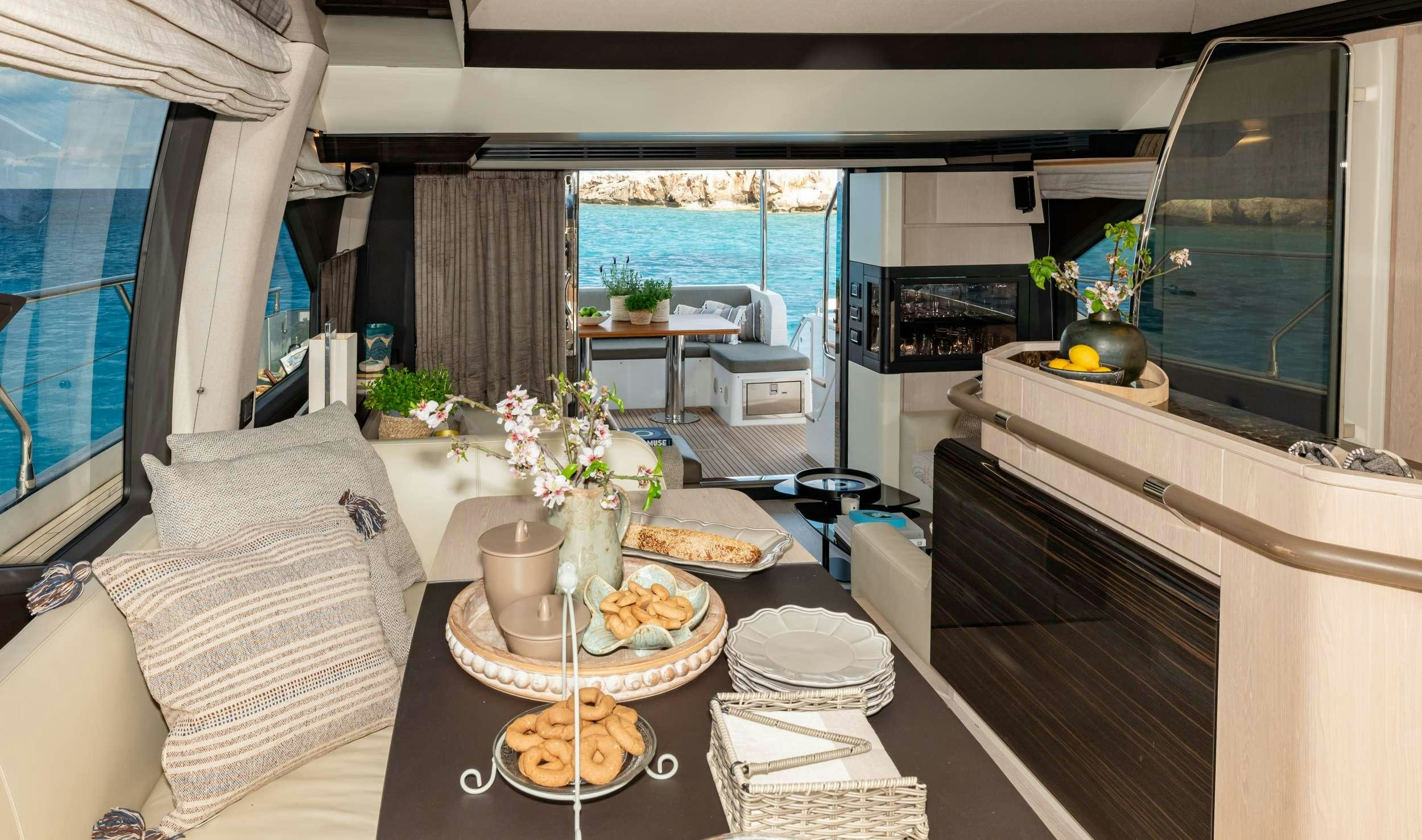 a room with a table and chairs aboard SEA YA Yacht for Charter