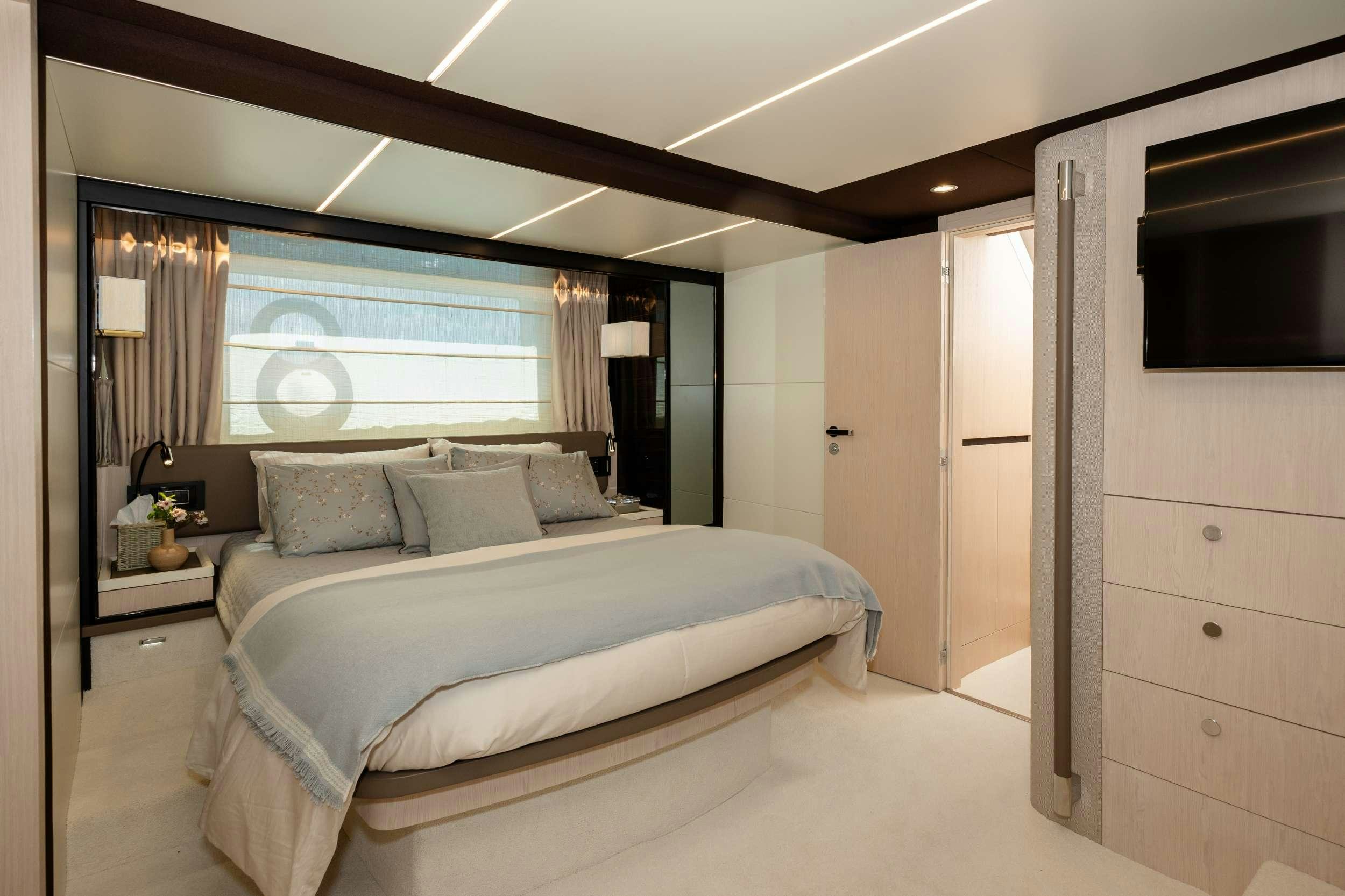 a bedroom with a large bed aboard SEA YA Yacht for Charter