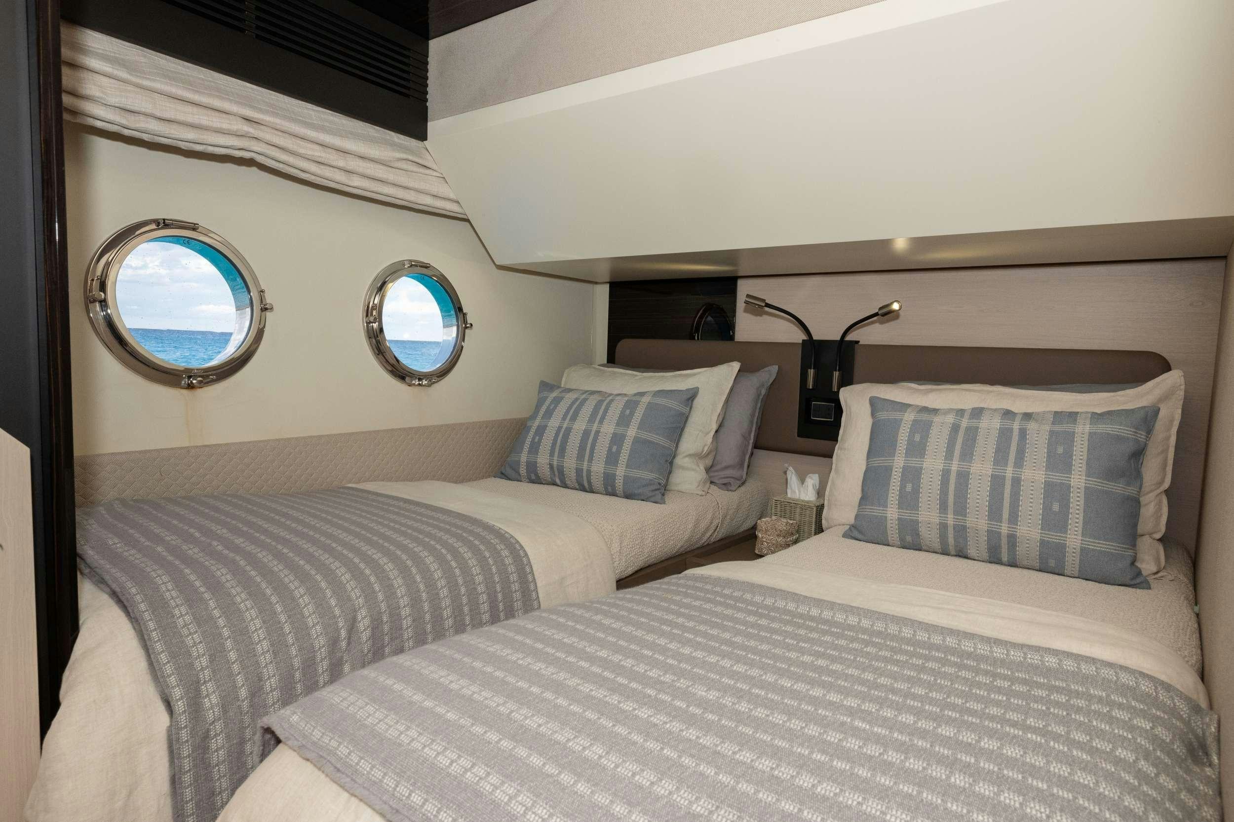 a couple of beds in a room aboard SEA YA Yacht for Charter