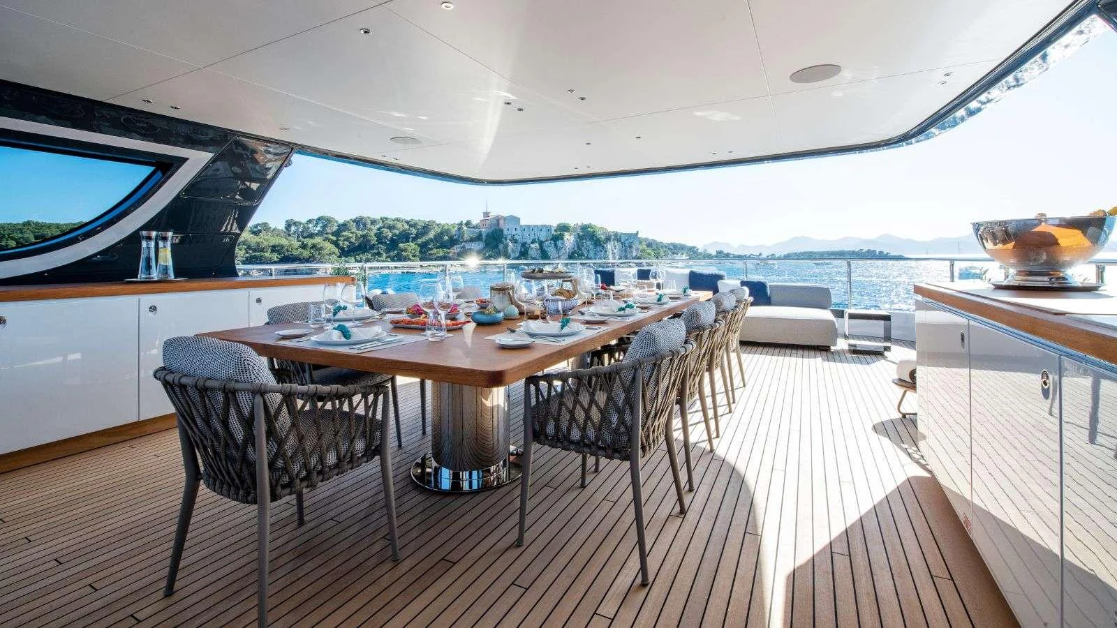 a dining table on a deck aboard NORTHERN ESCAPE Yacht for Charter