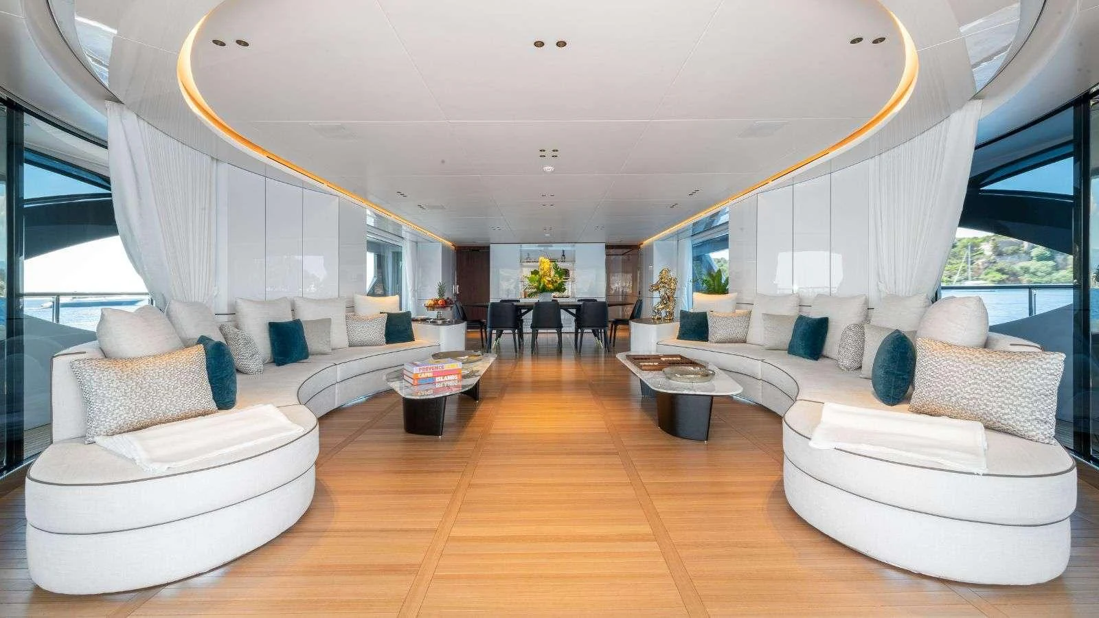 a living room with a large window aboard NORTHERN ESCAPE Yacht for Charter