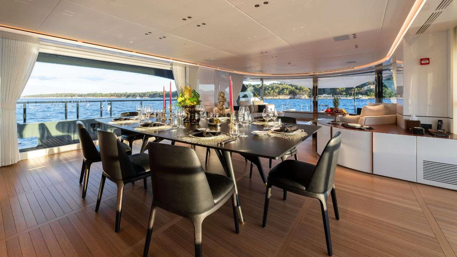 a large dining table with chairs around it aboard NORTHERN ESCAPE Yacht for Charter