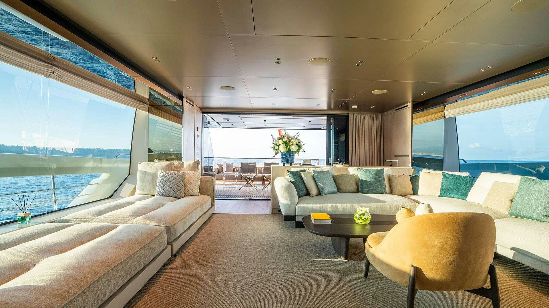 a living room with a large window aboard ON TIME Yacht for Charter