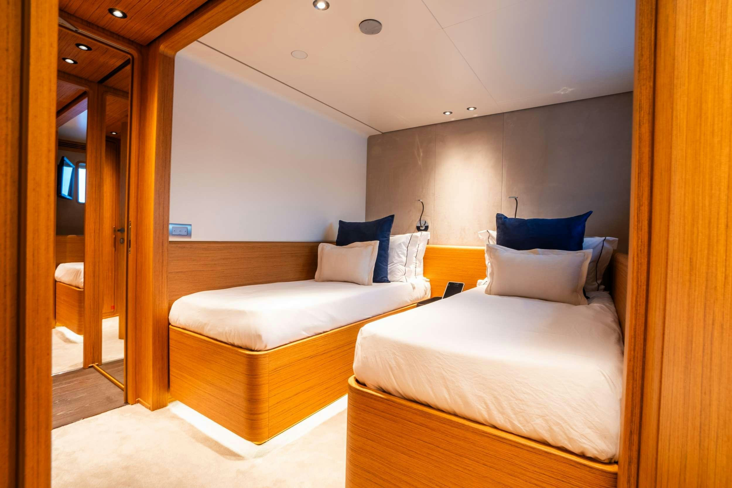 a room with a bed and a door aboard RARE GEM Yacht for Charter