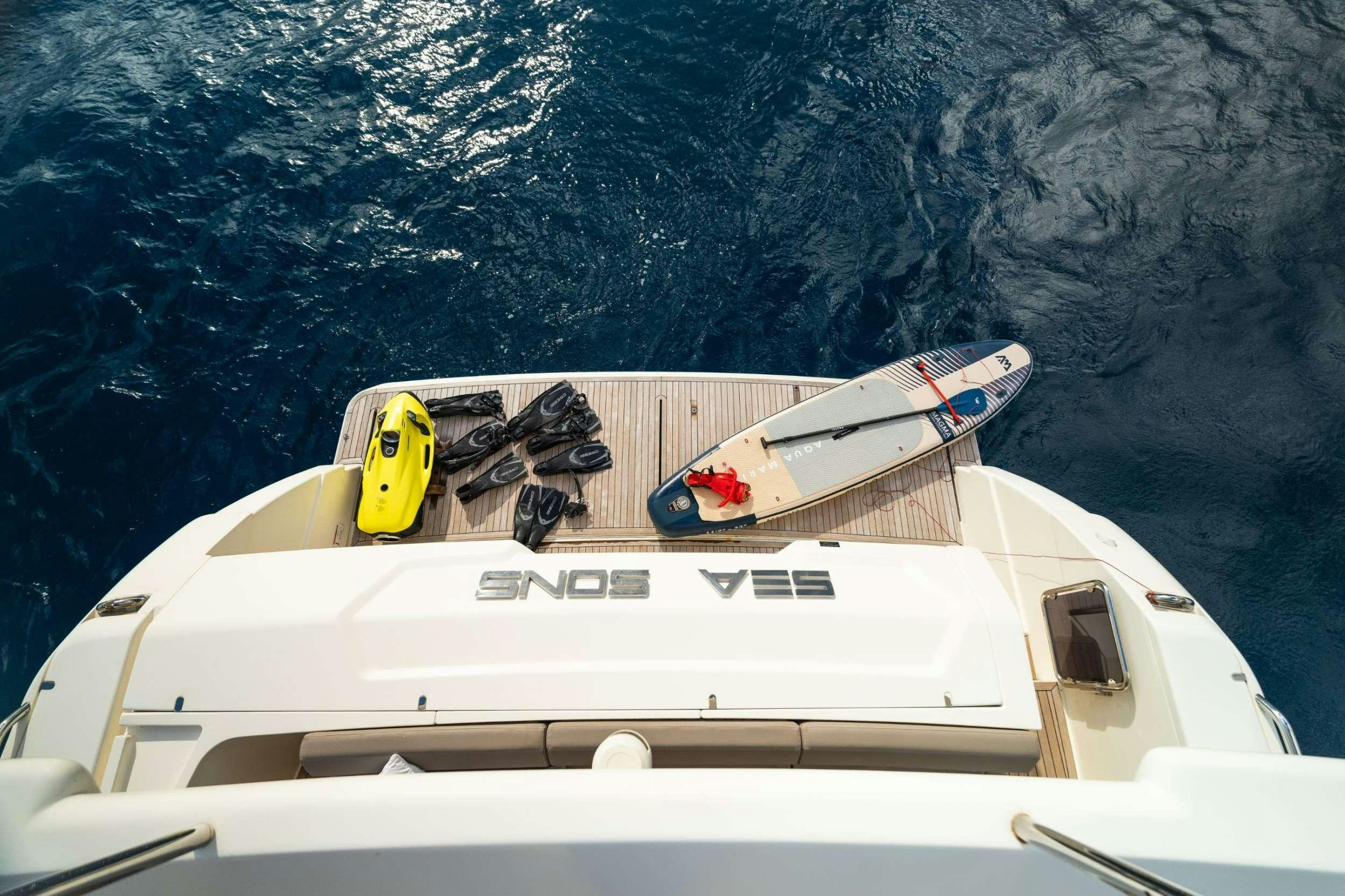 a boat with a snowmobile on it aboard SEA SONS Yacht for Charter