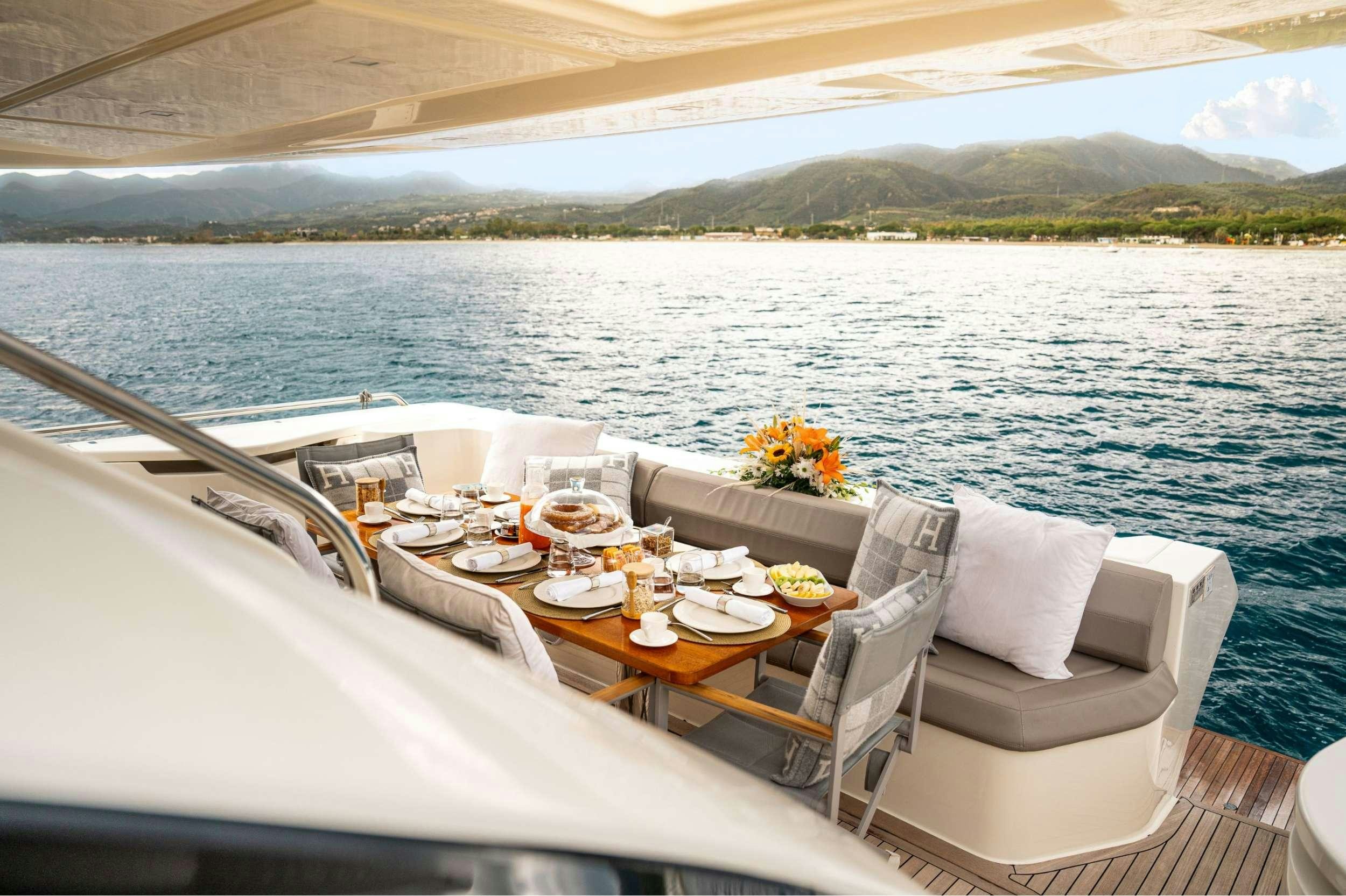 a boat with a table and chairs on it aboard SEA SONS Yacht for Charter
