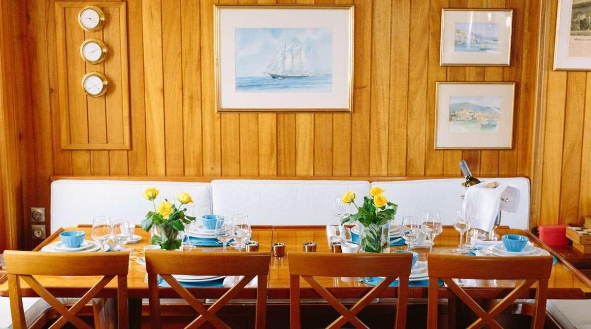 a room with tables and chairs aboard SIR WINSTON CHURCHILL Yacht for Charter