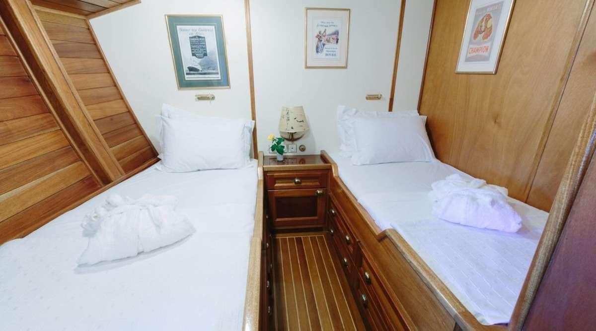 a room with two beds aboard SIR WINSTON CHURCHILL Yacht for Charter
