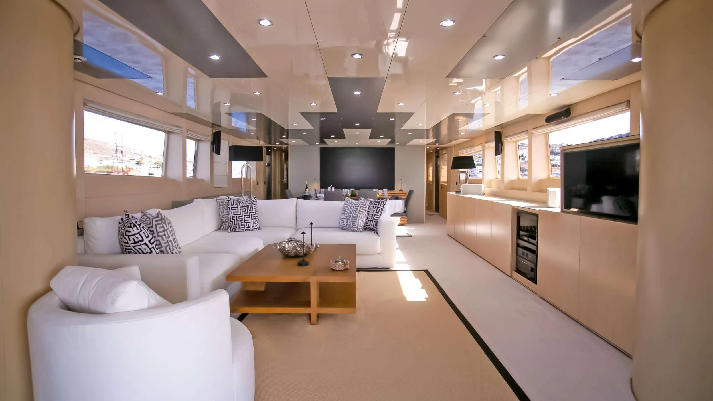 a living room with a couch and a coffee table aboard MARAYA Yacht for Charter