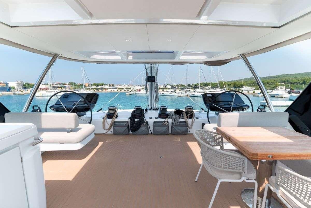 a boat with a table and chairs aboard SEADUCTIVE ORCA Yacht for Charter
