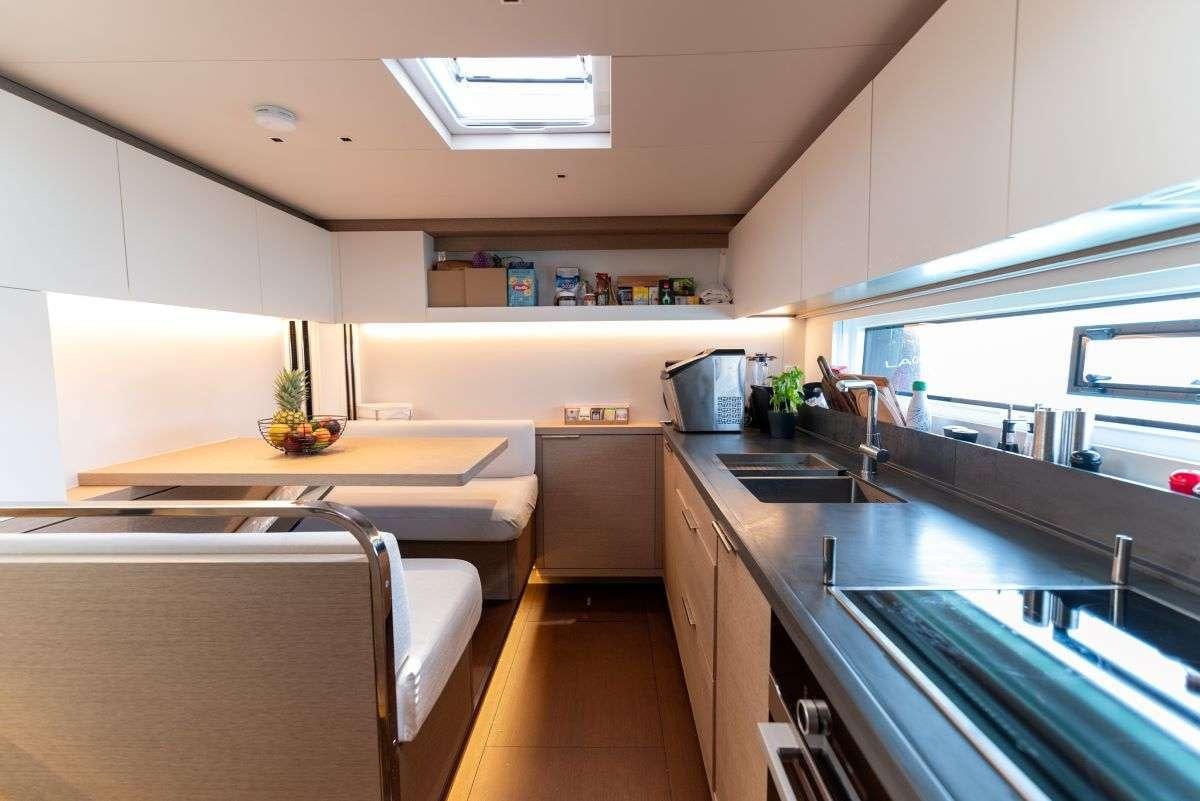 a kitchen with a large island aboard SEADUCTIVE ORCA Yacht for Charter