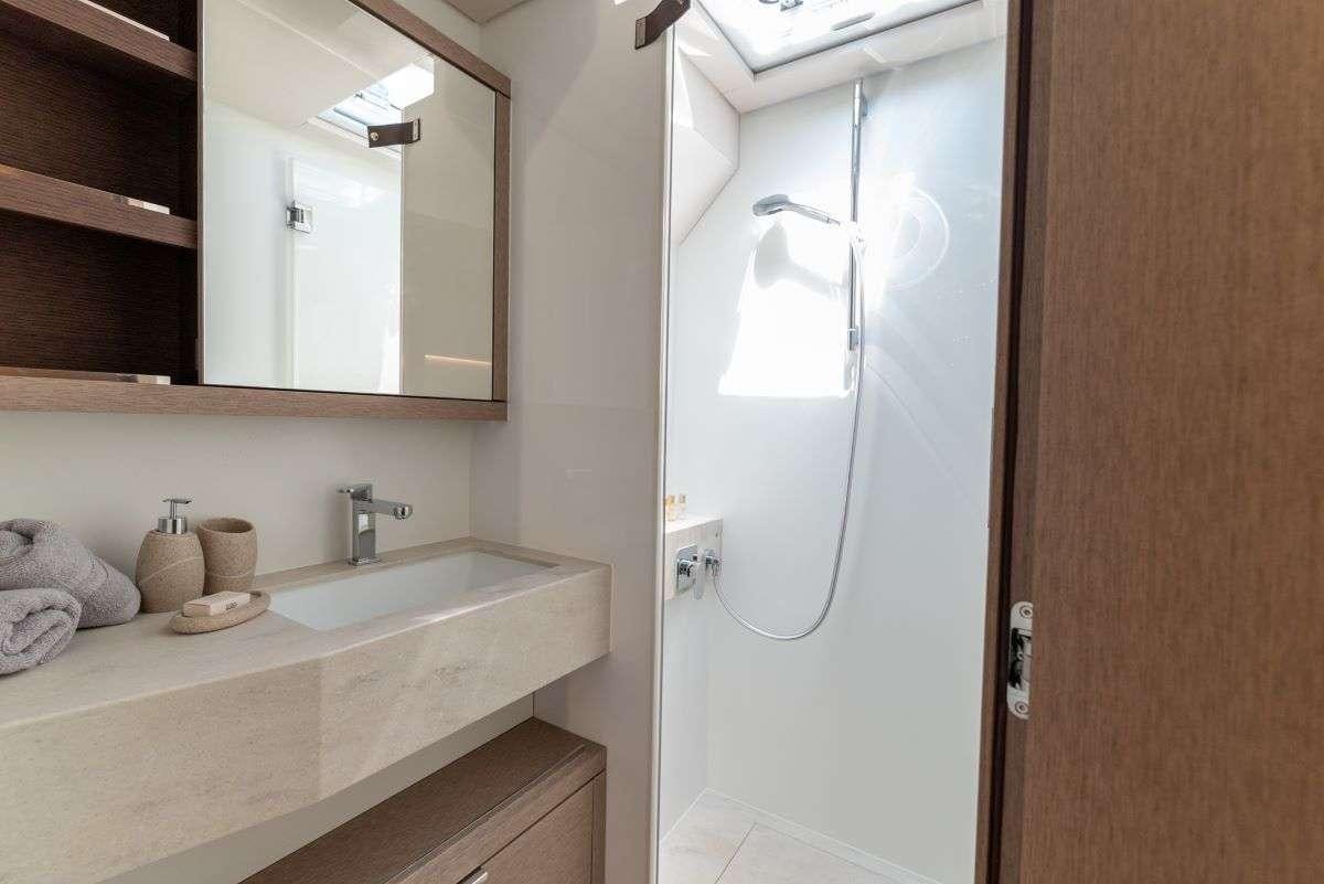 a bathroom with a large mirror aboard SEADUCTIVE ORCA Yacht for Charter