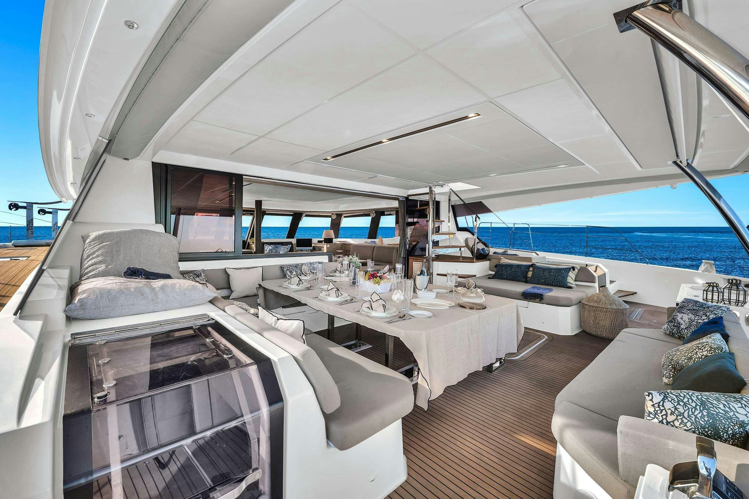 a room with a bed and a table aboard ERA Yacht for Charter