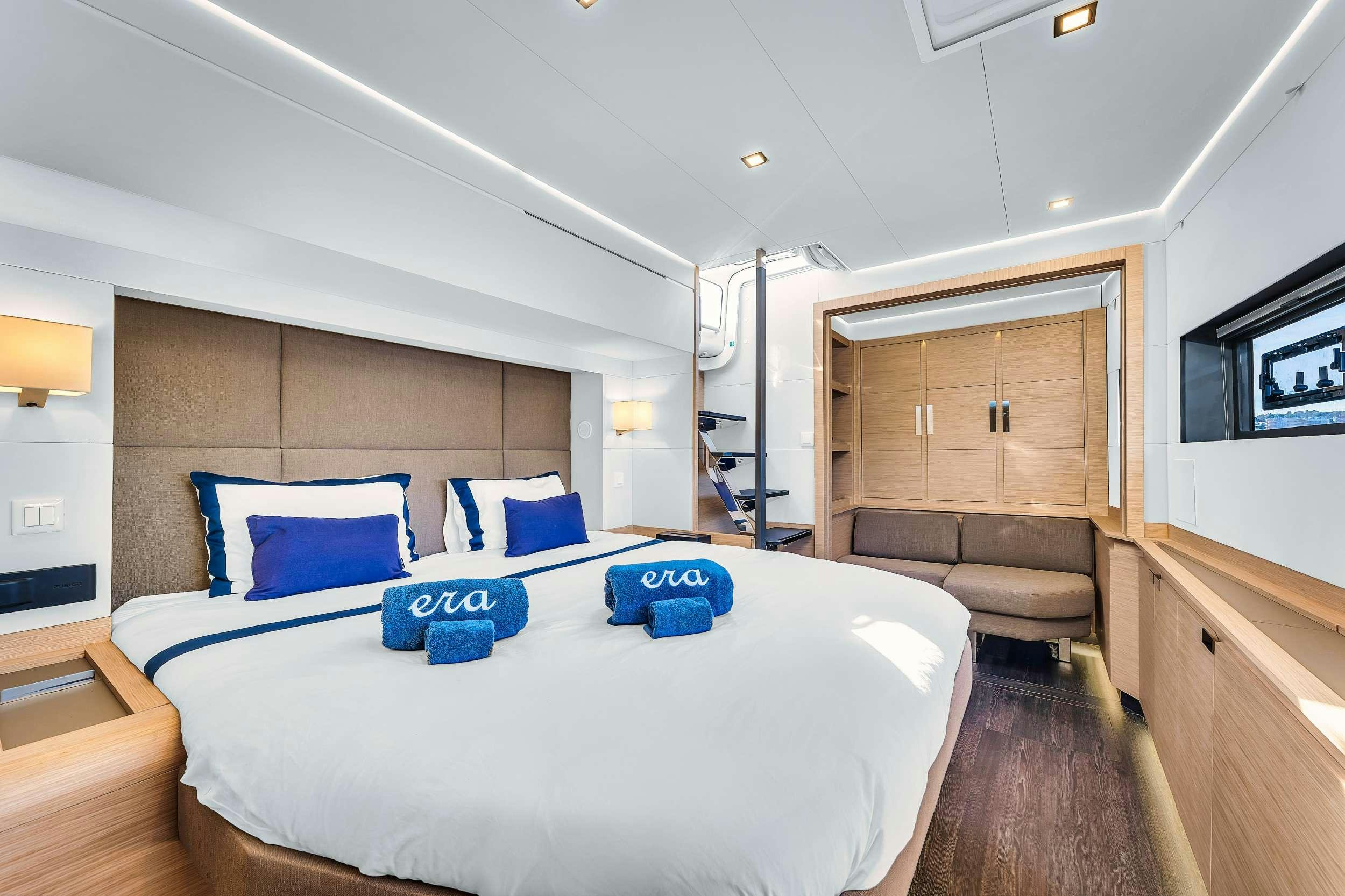 a bed in a room aboard ERA Yacht for Charter