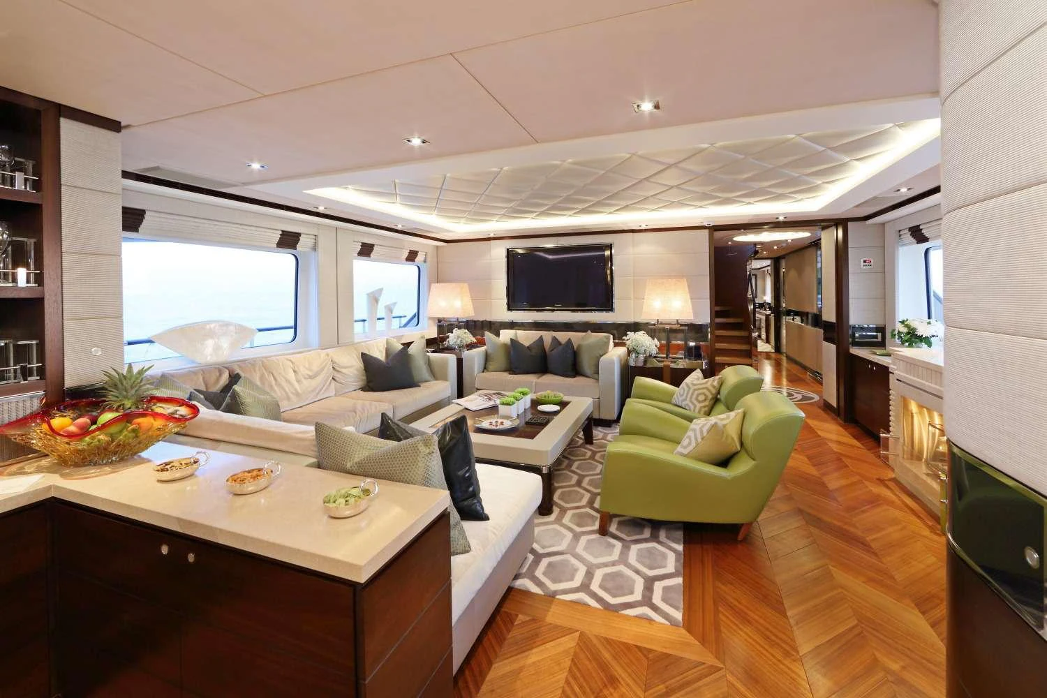 a living room with a couch and a table aboard AURELIA Yacht for Charter