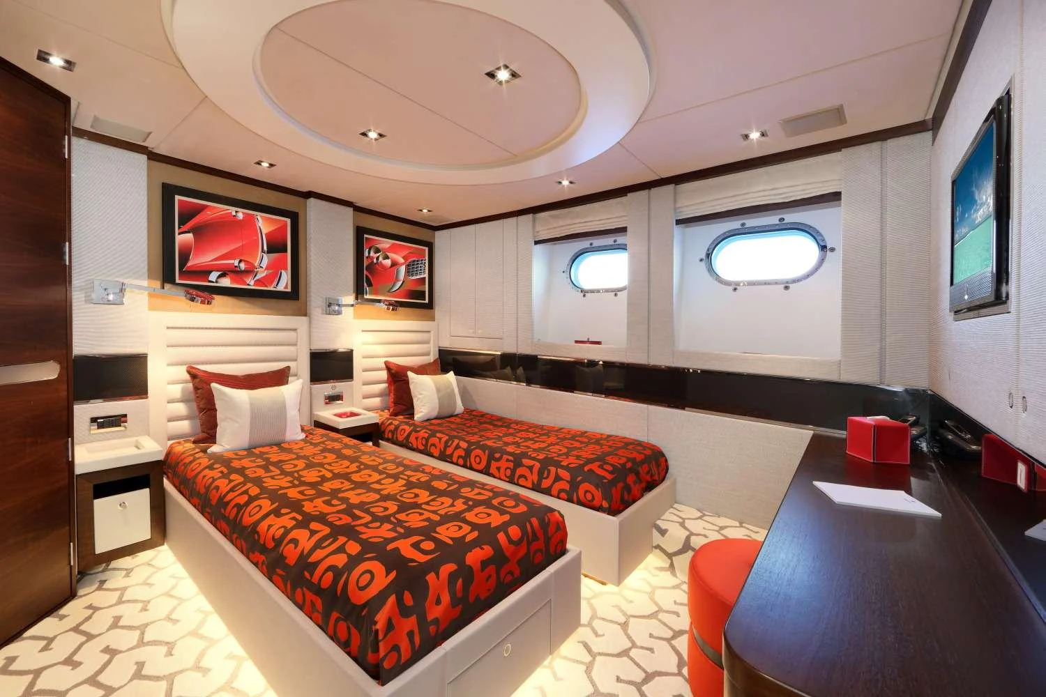 a room with a bed and a tv aboard AURELIA Yacht for Charter