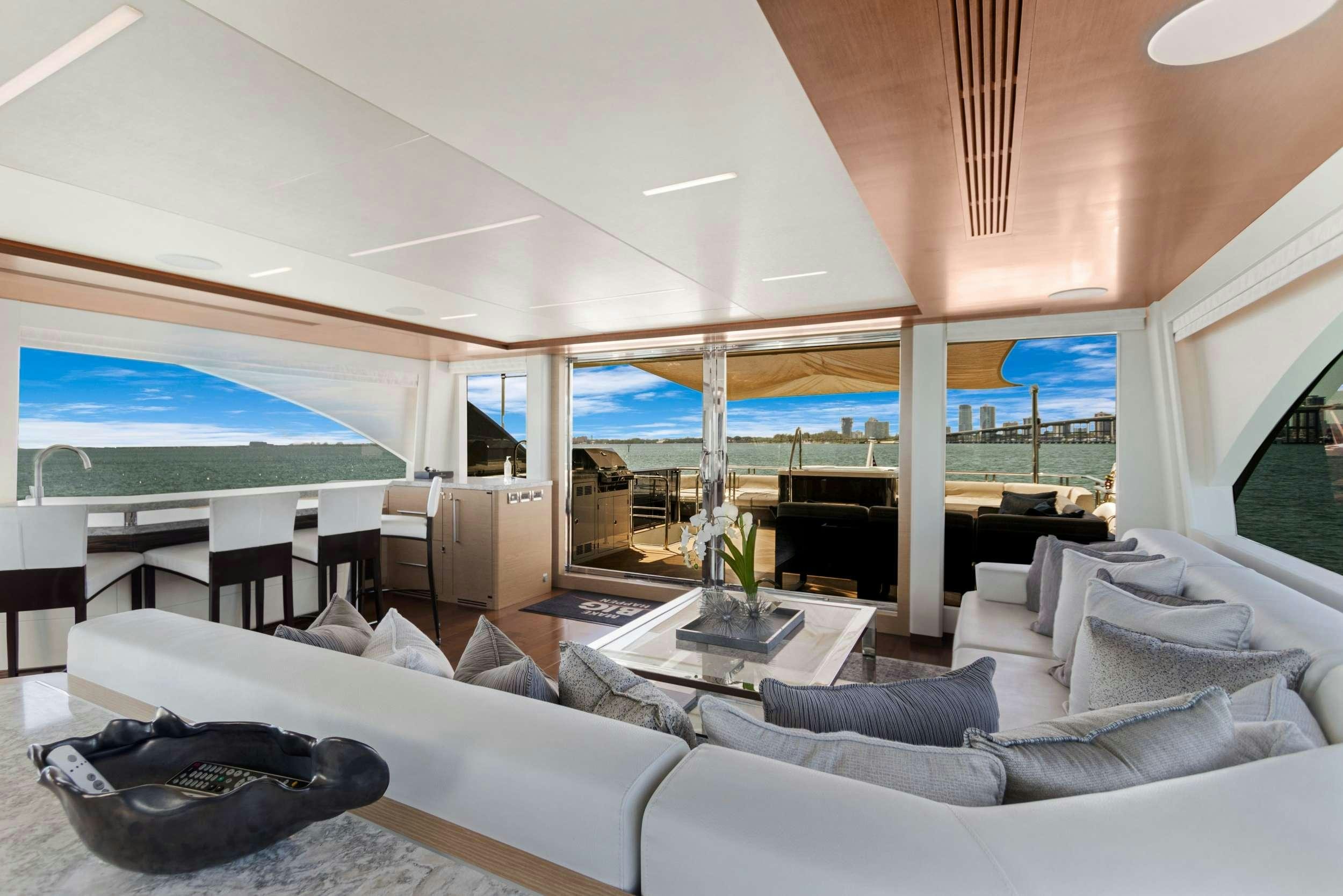 a living room with a large window aboard MAKE BIG HAPPEN Yacht for Charter