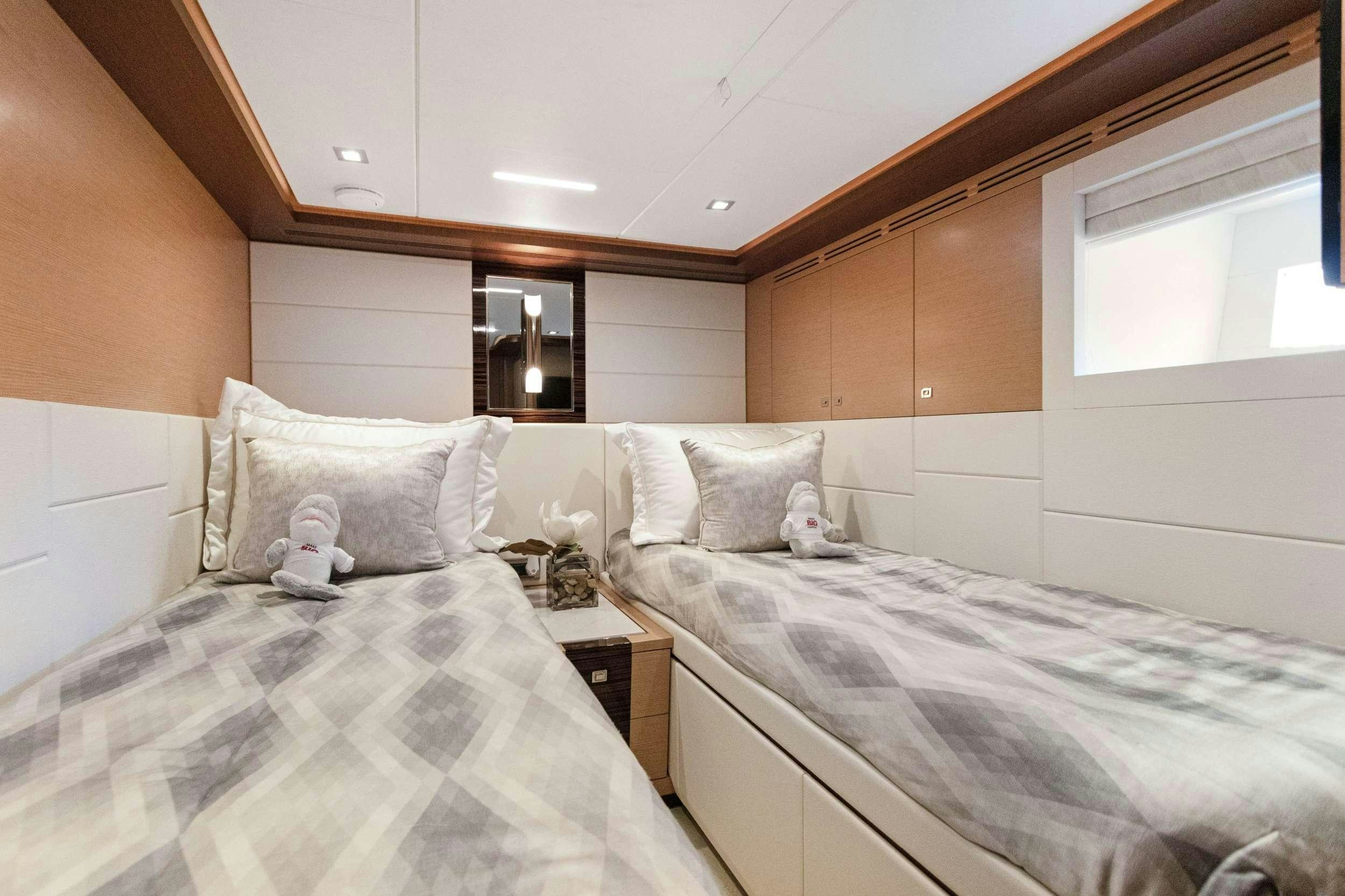 a room with two beds aboard MAKE BIG HAPPEN Yacht for Charter