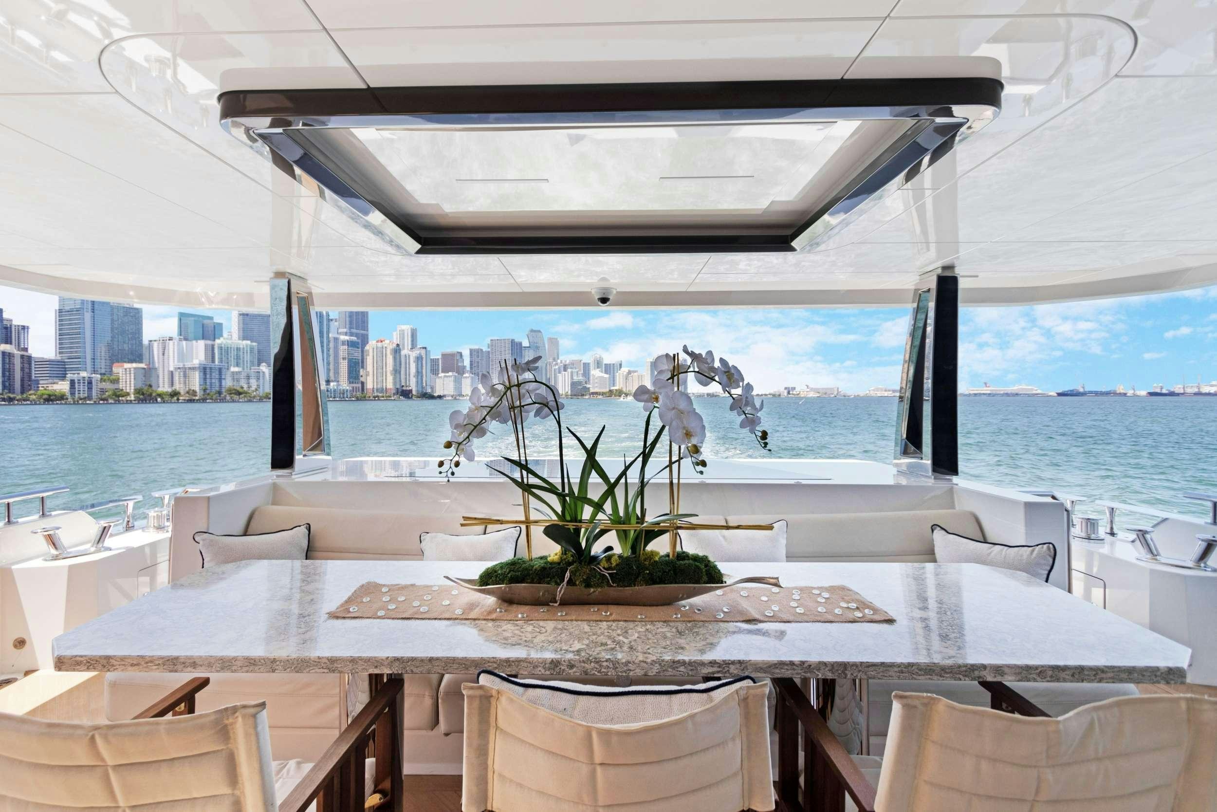 a table with a plant on it aboard MAKE BIG HAPPEN Yacht for Charter