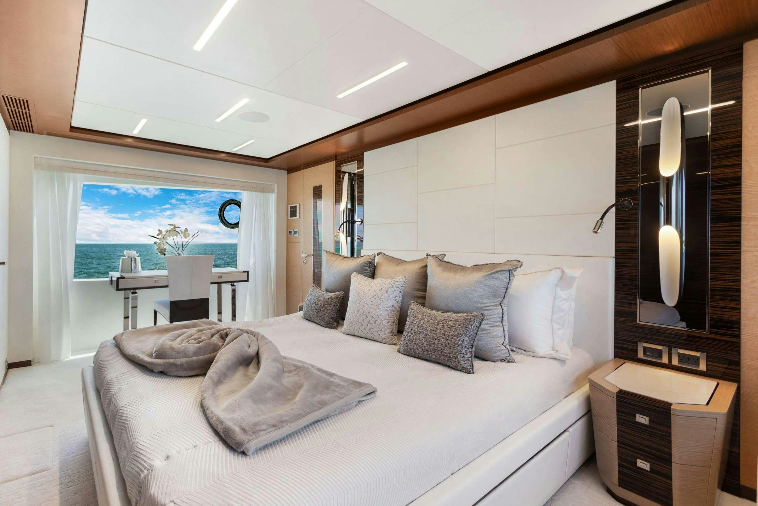 a large bed in a room aboard MAKE BIG HAPPEN Yacht for Charter