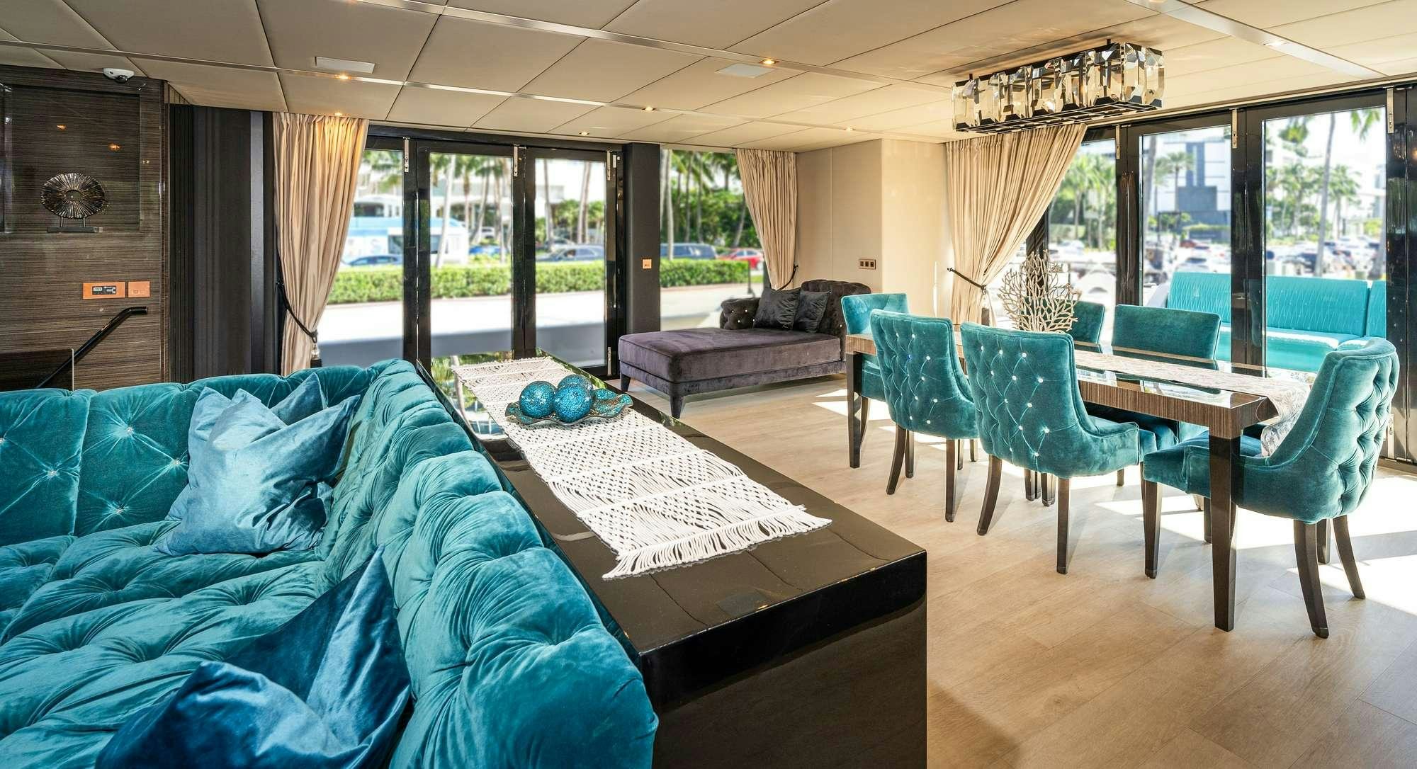 a room with a bed and a couch aboard ROCK STAR 2.0 Yacht for Charter