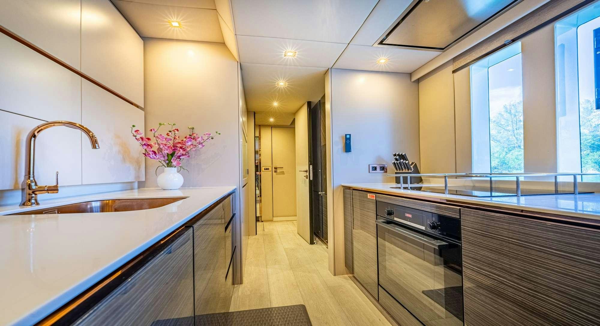 a kitchen with a large island aboard ROCK STAR 2.0 Yacht for Charter