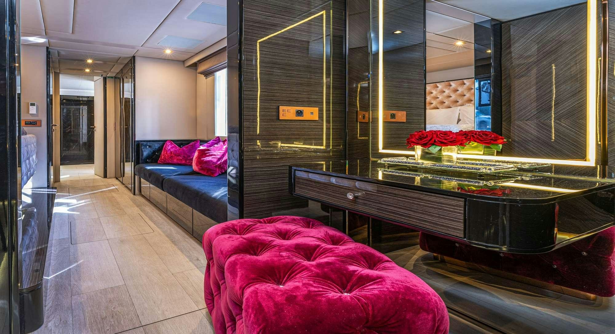 a room with a bed and a desk aboard ROCK STAR 2.0 Yacht for Charter