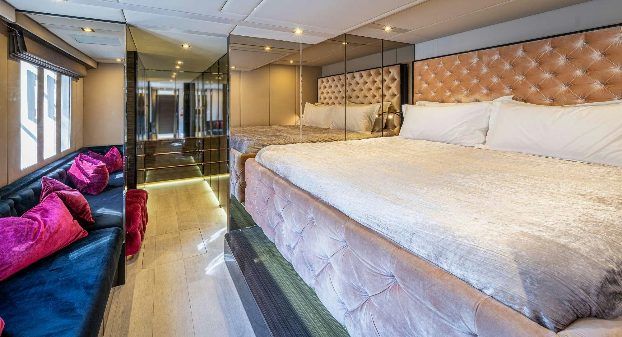 a room with a bed and a couch aboard ROCK STAR 2.0 Yacht for Charter