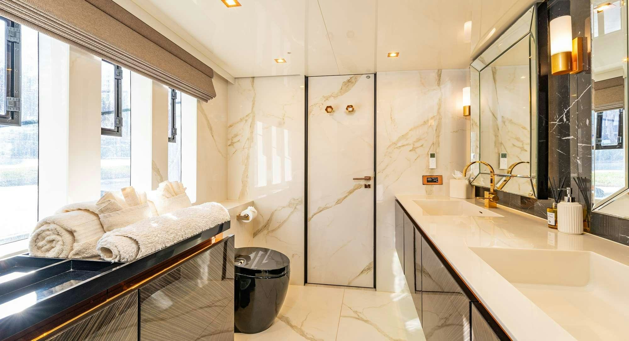 a bathroom with a sink and a bathtub aboard ROCK STAR 2.0 Yacht for Charter
