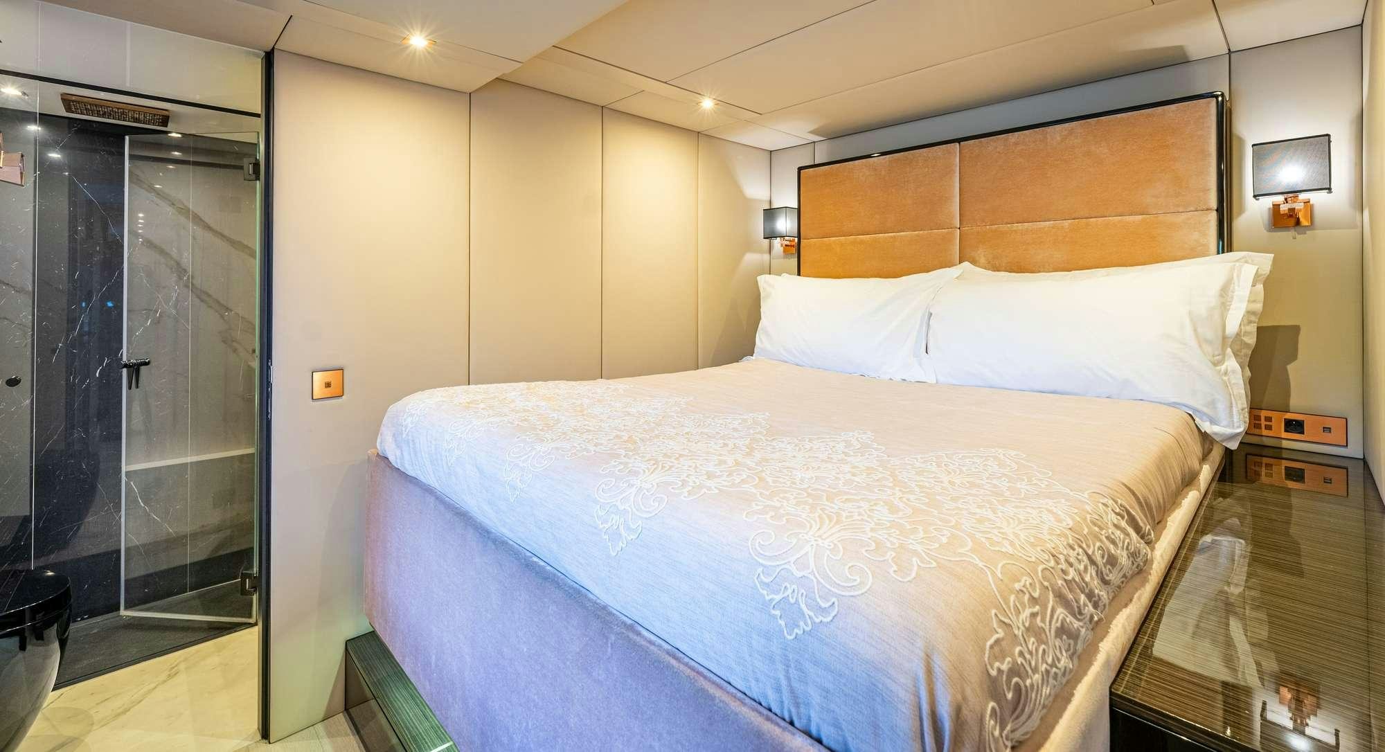 a bed with white sheets aboard ROCK STAR 2.0 Yacht for Charter