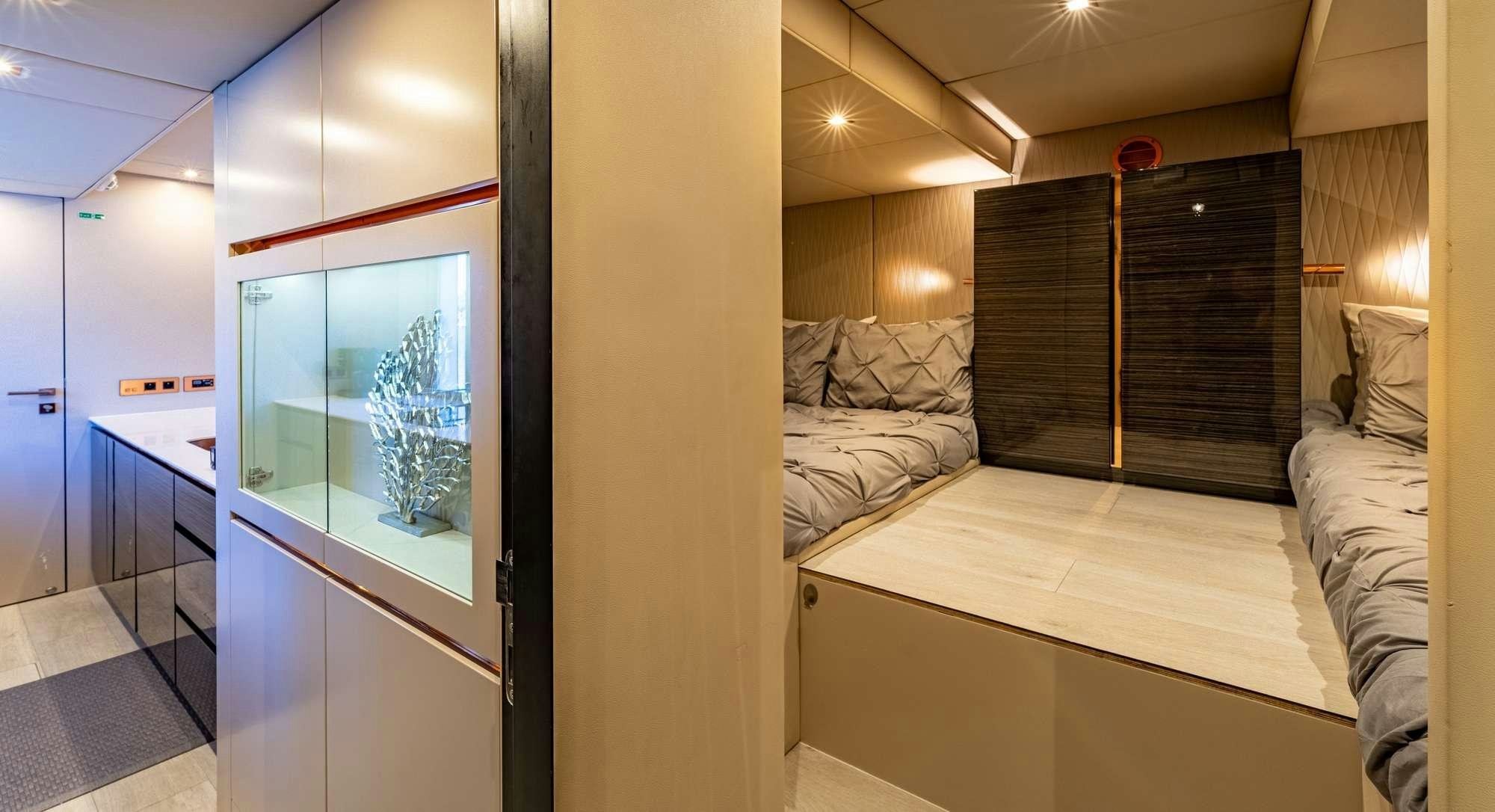 a room with a bed and a large window aboard ROCK STAR 2.0 Yacht for Charter
