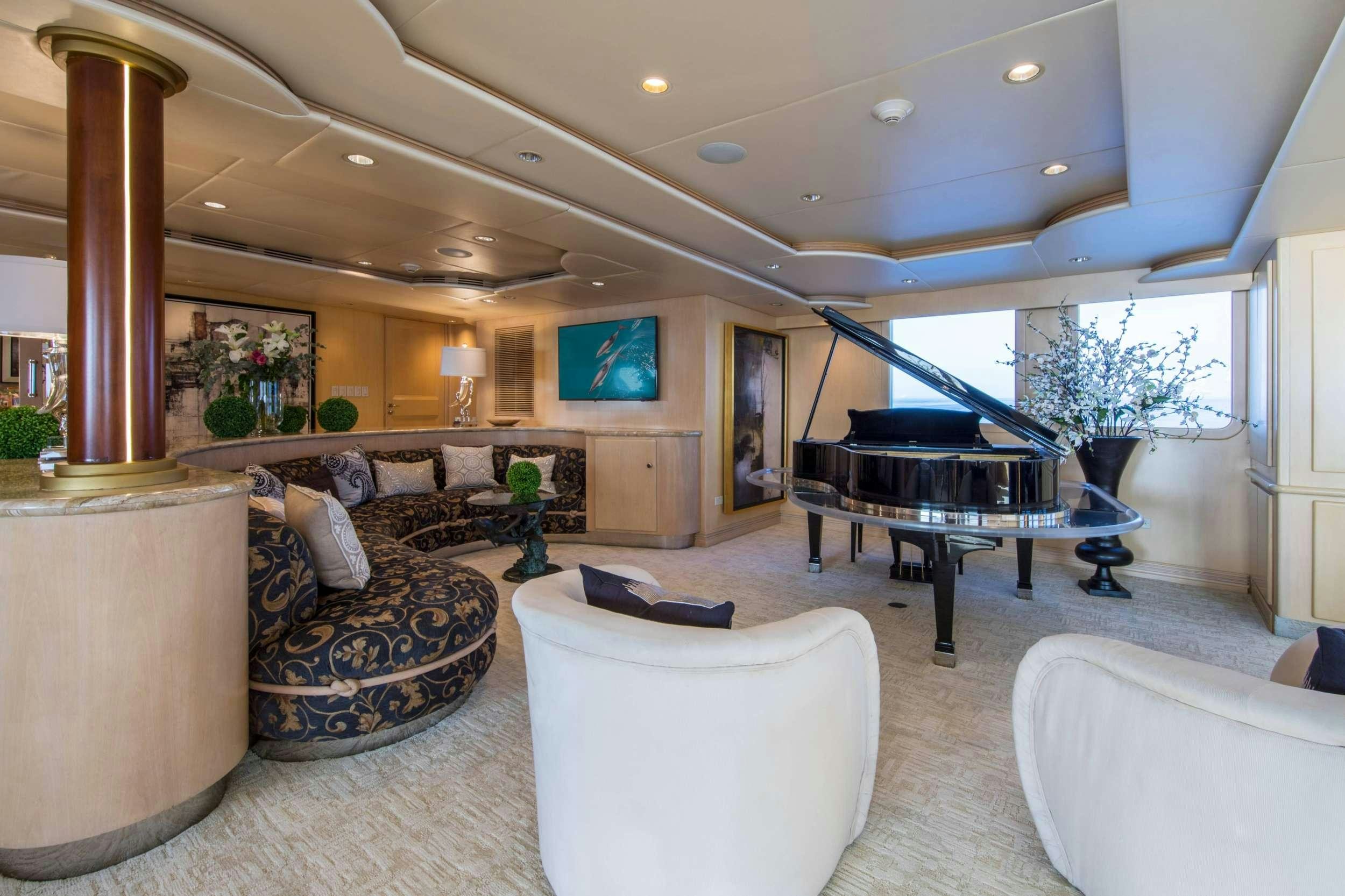 a living room with a piano aboard GRACE Yacht for Charter