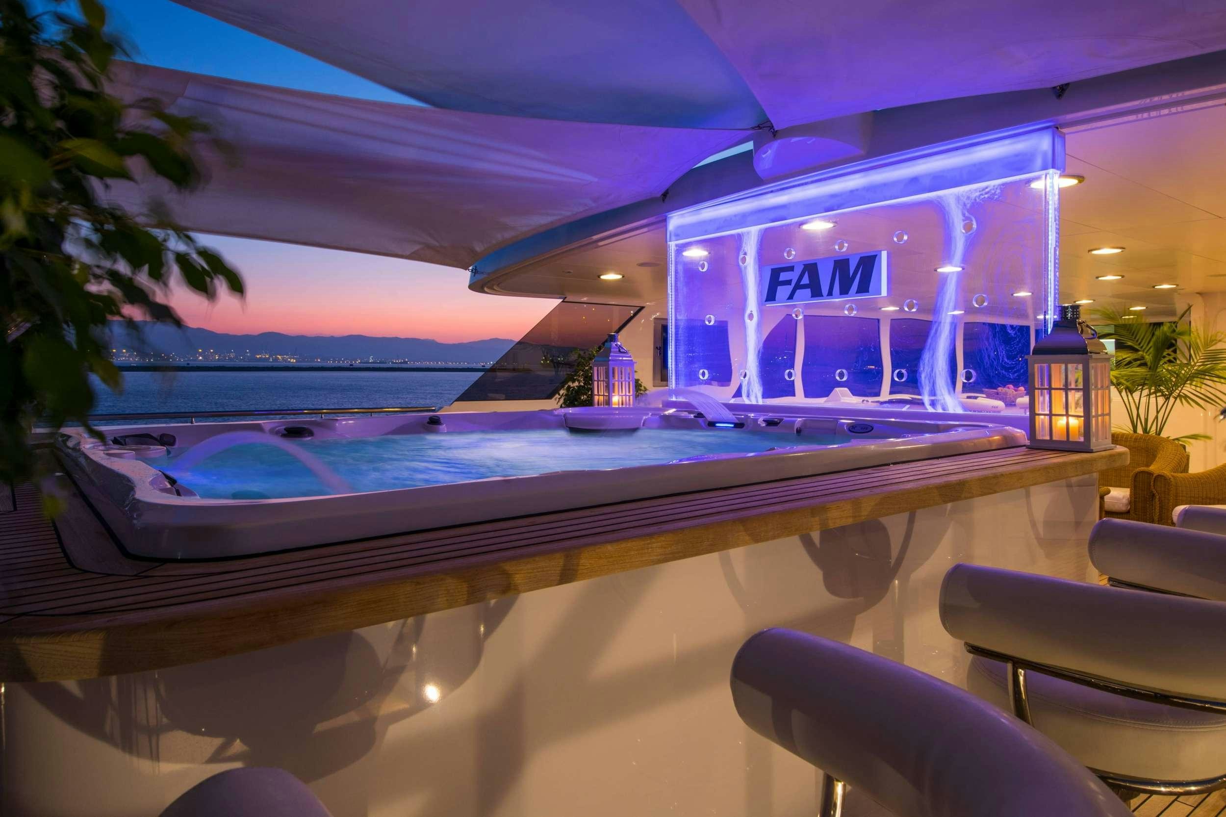 a pool at night aboard GRACE Yacht for Charter