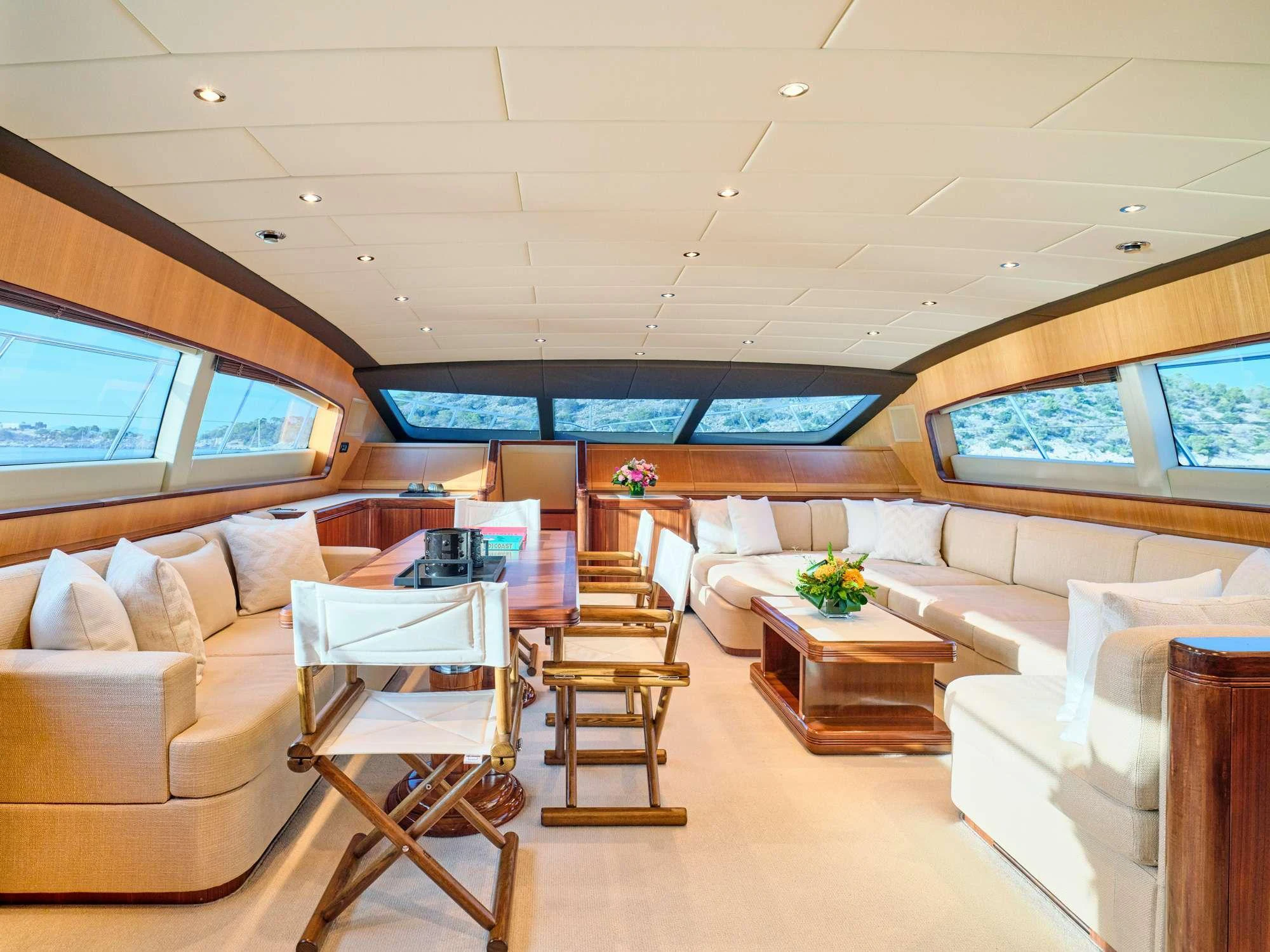 a living room with a large screen aboard WET PANTHER Yacht for Charter