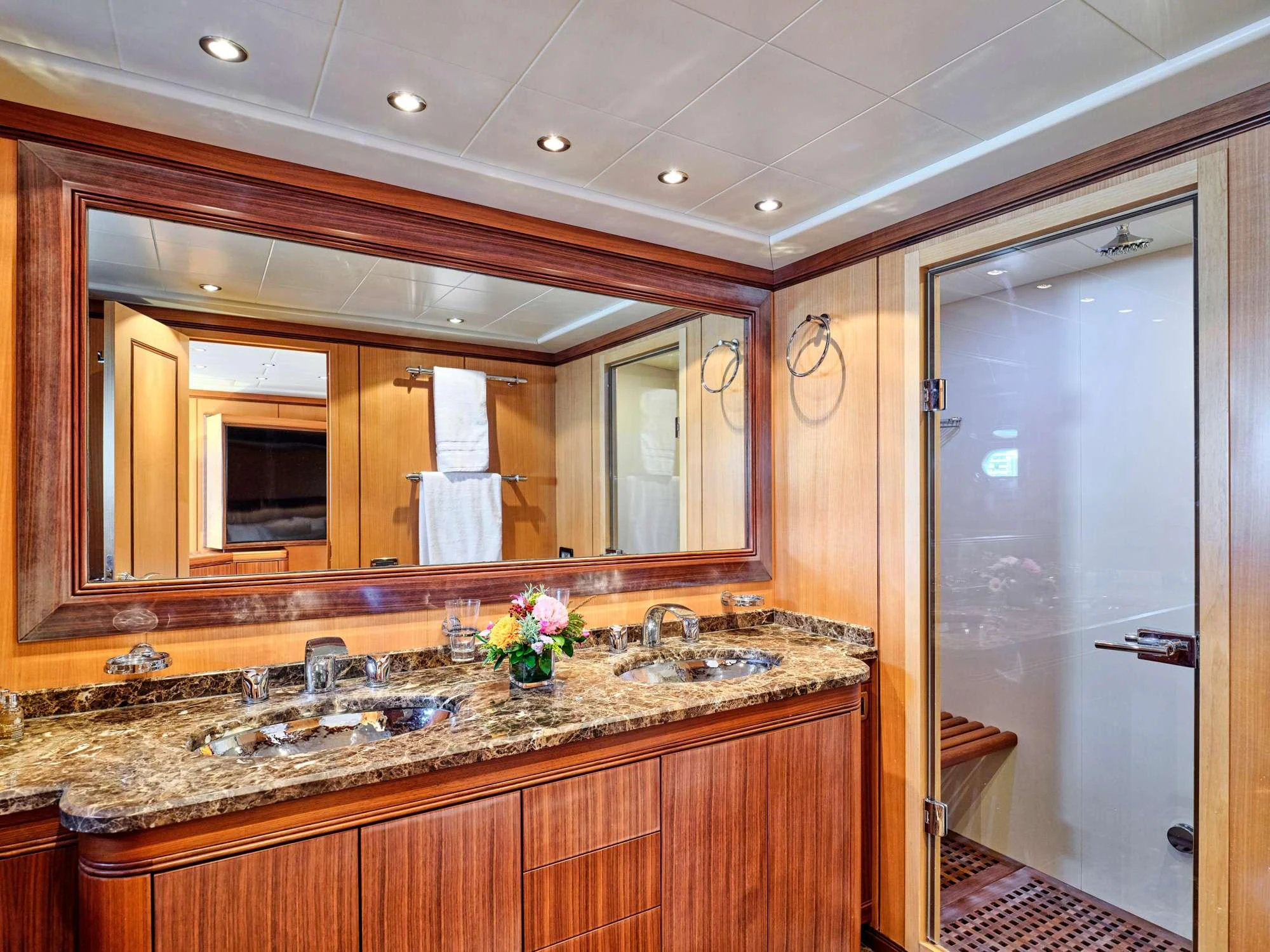 a bathroom with a large mirror aboard WET PANTHER Yacht for Charter