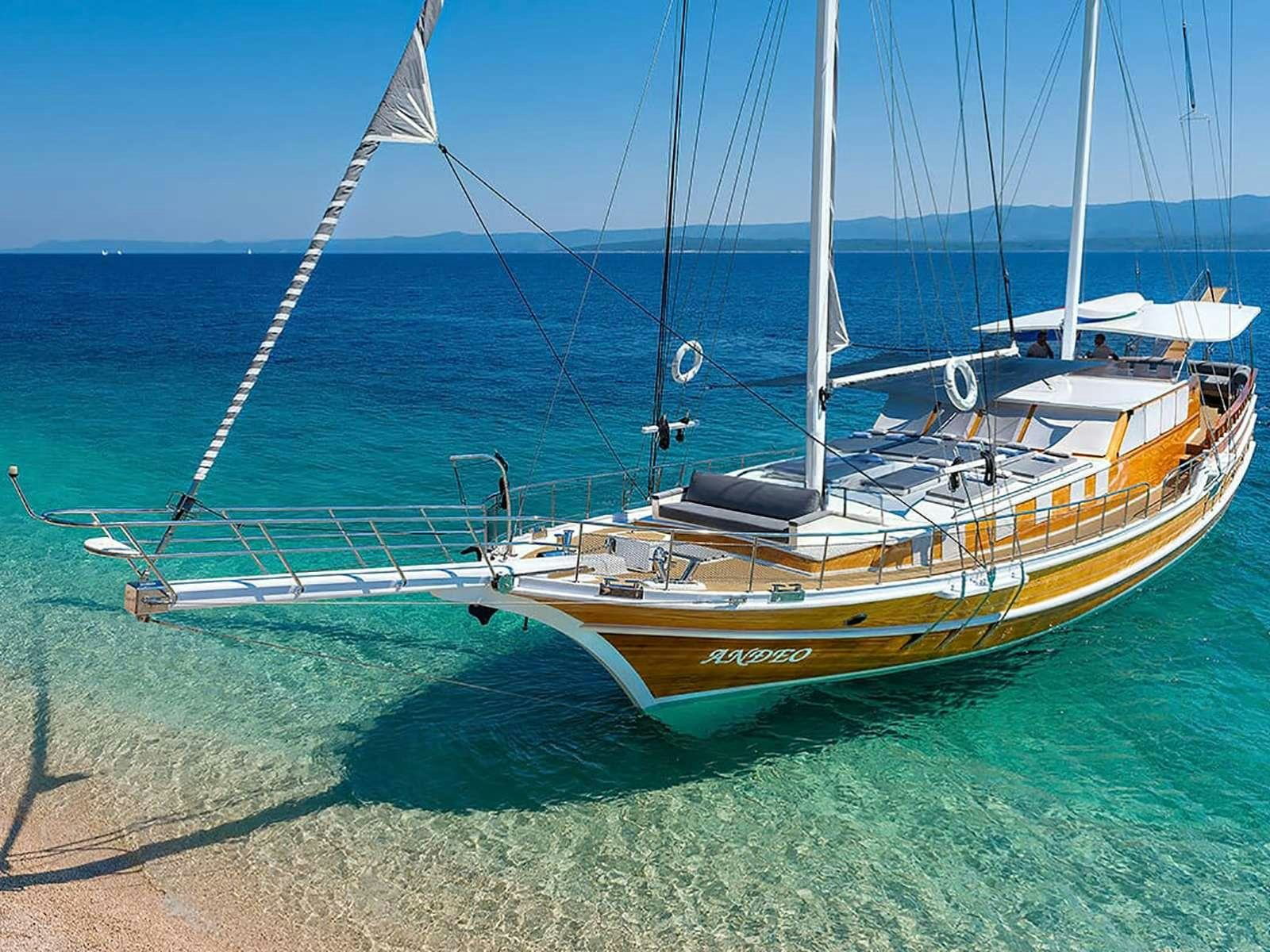 a boat on the beach aboard ANĐEO Yacht for Charter
