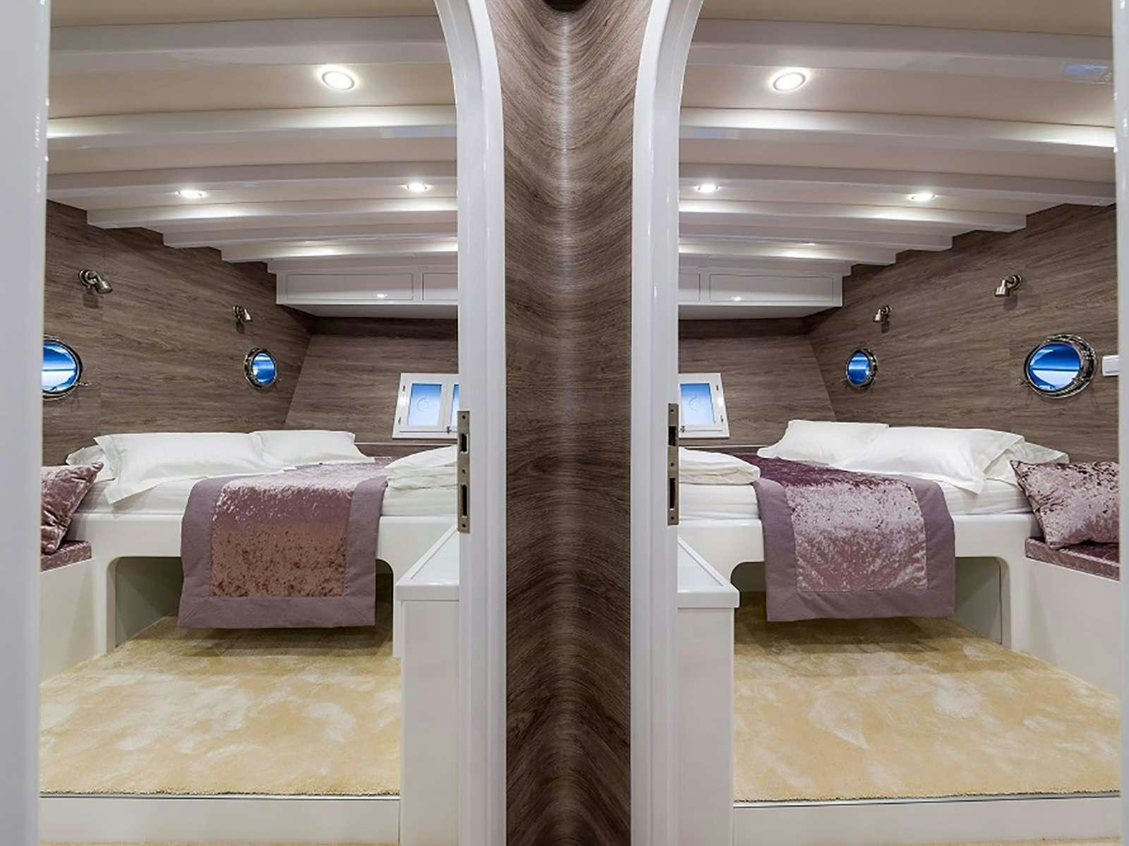 a room with a wood floor and a window aboard ANĐEO Yacht for Charter
