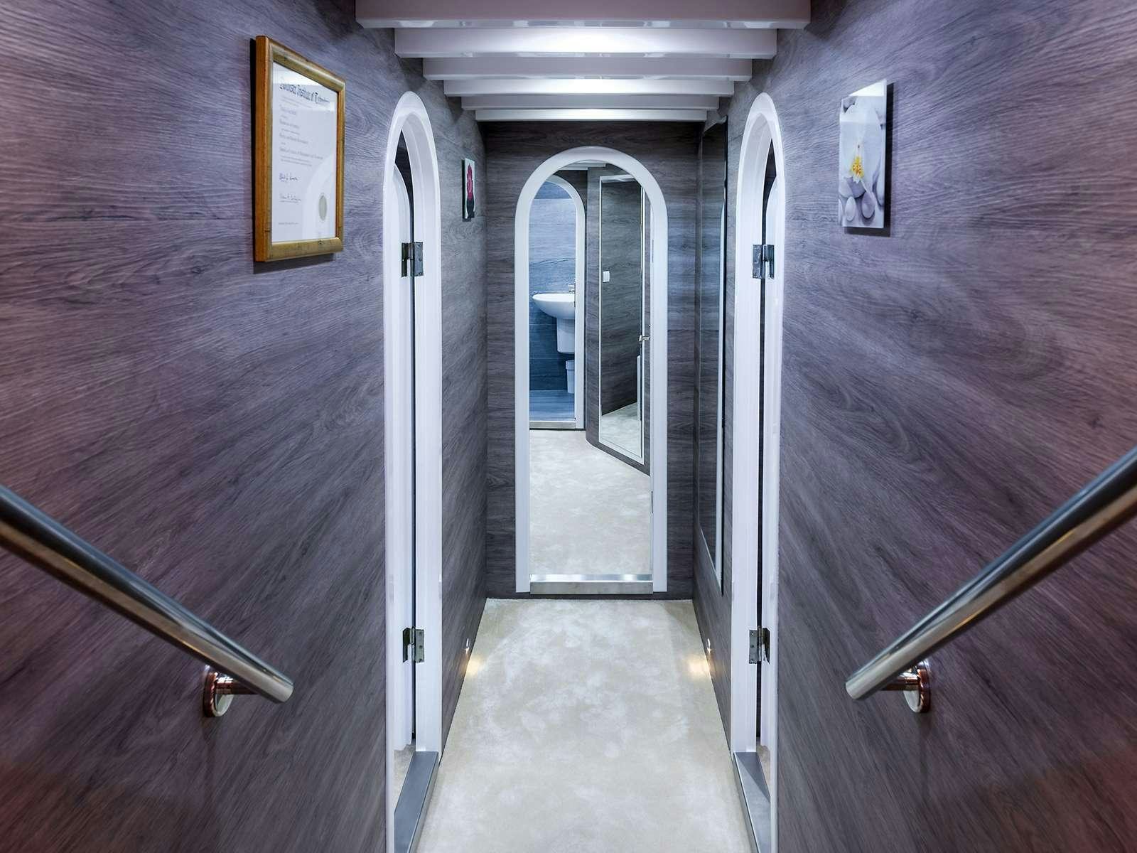 a hallway with doors aboard ANĐEO Yacht for Charter