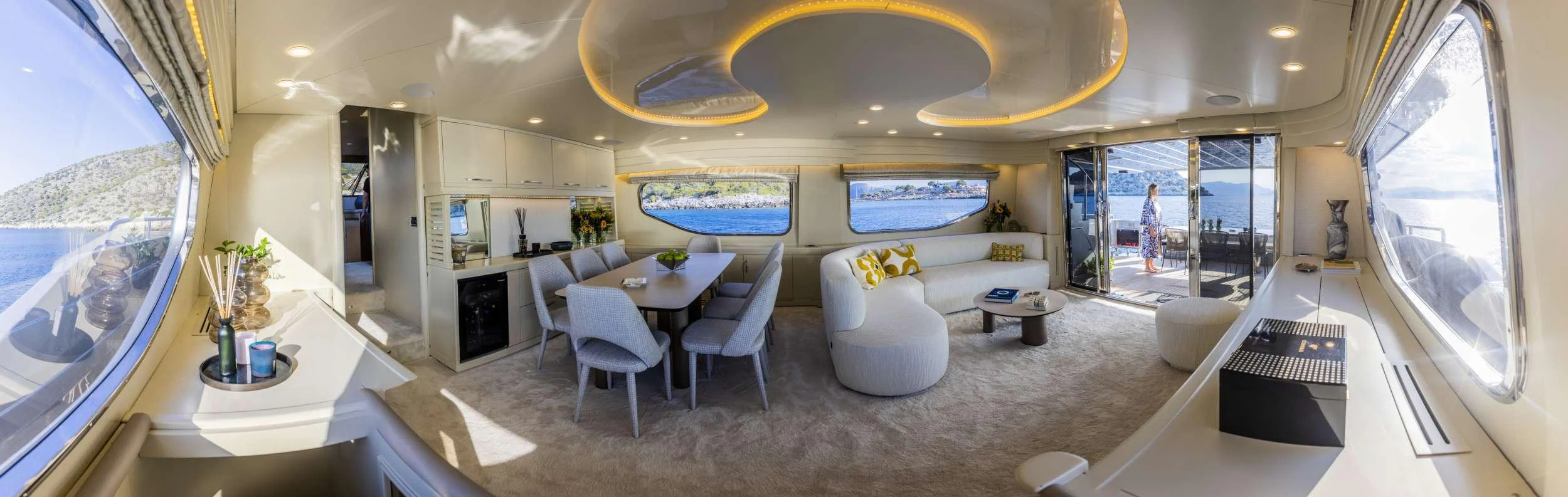 a room with a table chairs and a window aboard ANDROMEDA Yacht for Charter