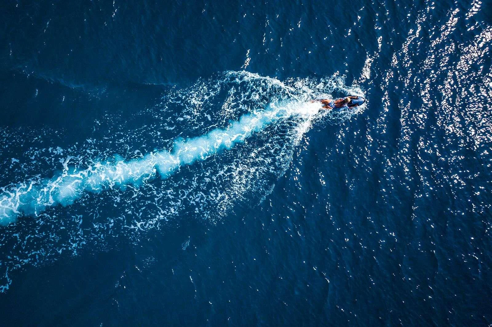 a person swimming in water aboard ANDROMEDA Yacht for Charter